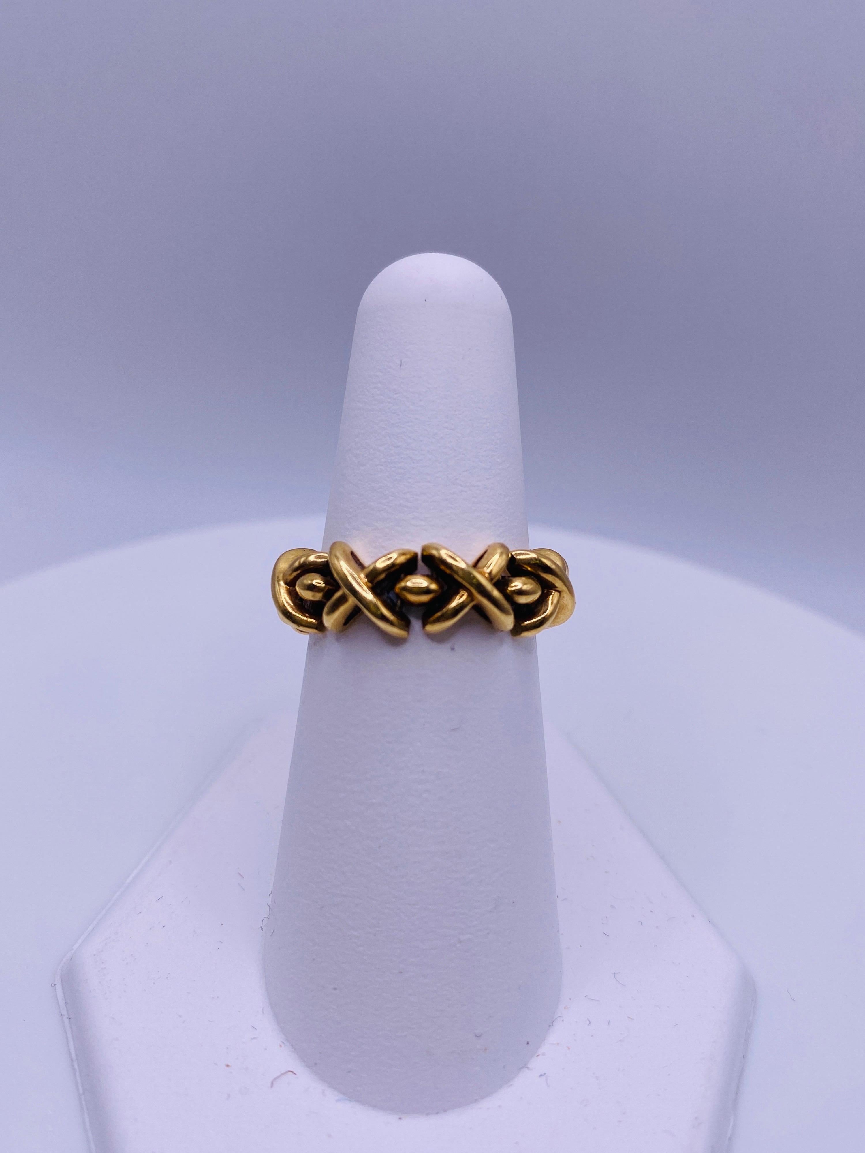 Tiffany & Co 18k yellow gold XOXO flex ring. 4.6Dwt. Size 6.75