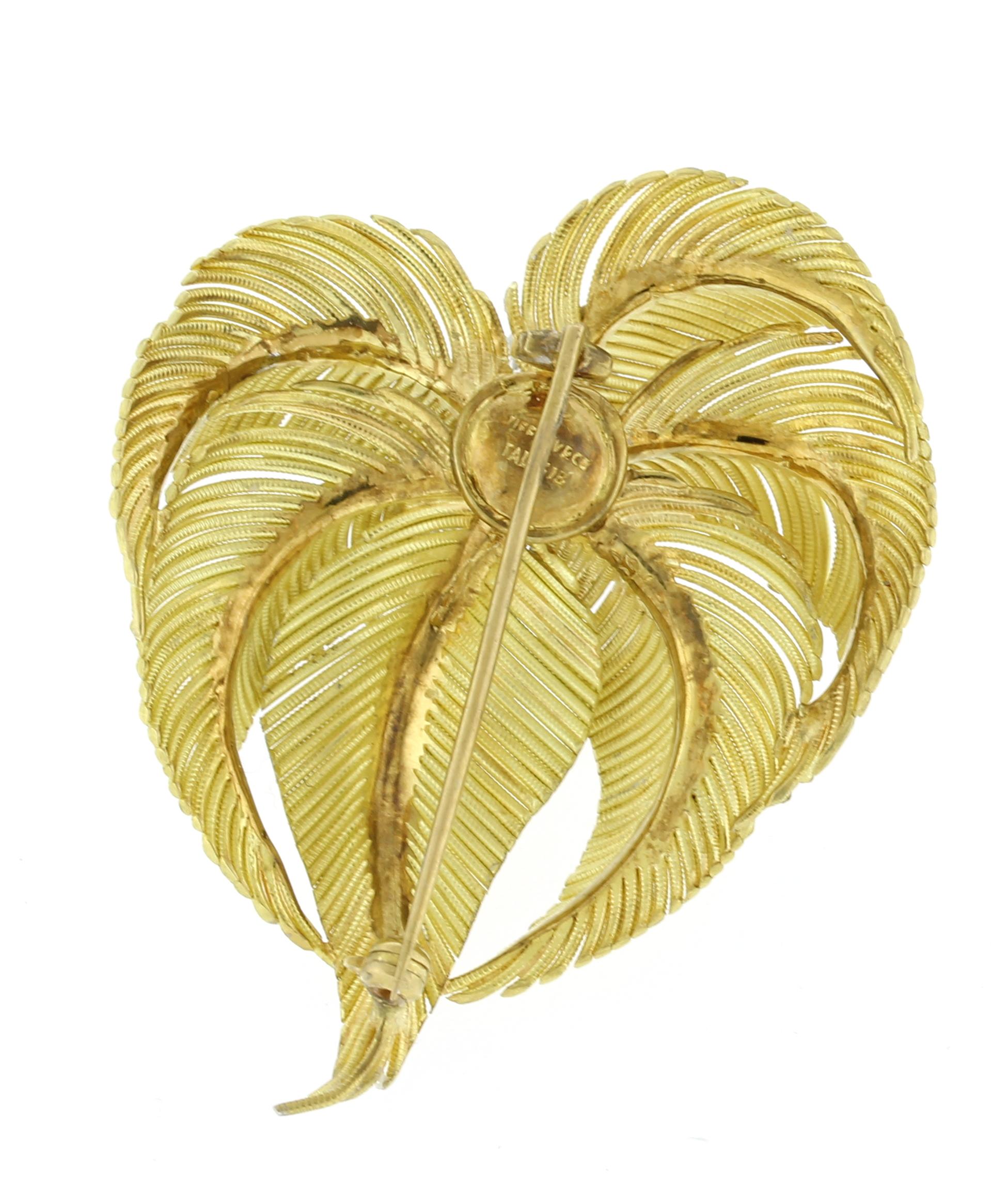 From Tiffany & Co., this palm brooch was made in Italy.
♦ Designer: Tiffany & Co
♦ Metal: 18kt yellow gold and platinum
♦ Dimensions: 2 1/4 by 1 3/4 inches
♦ Gemstone: 9Diamond = Approx .45cts
♦ Packaging: Tiffany Box
♦ Condition: Excellent,