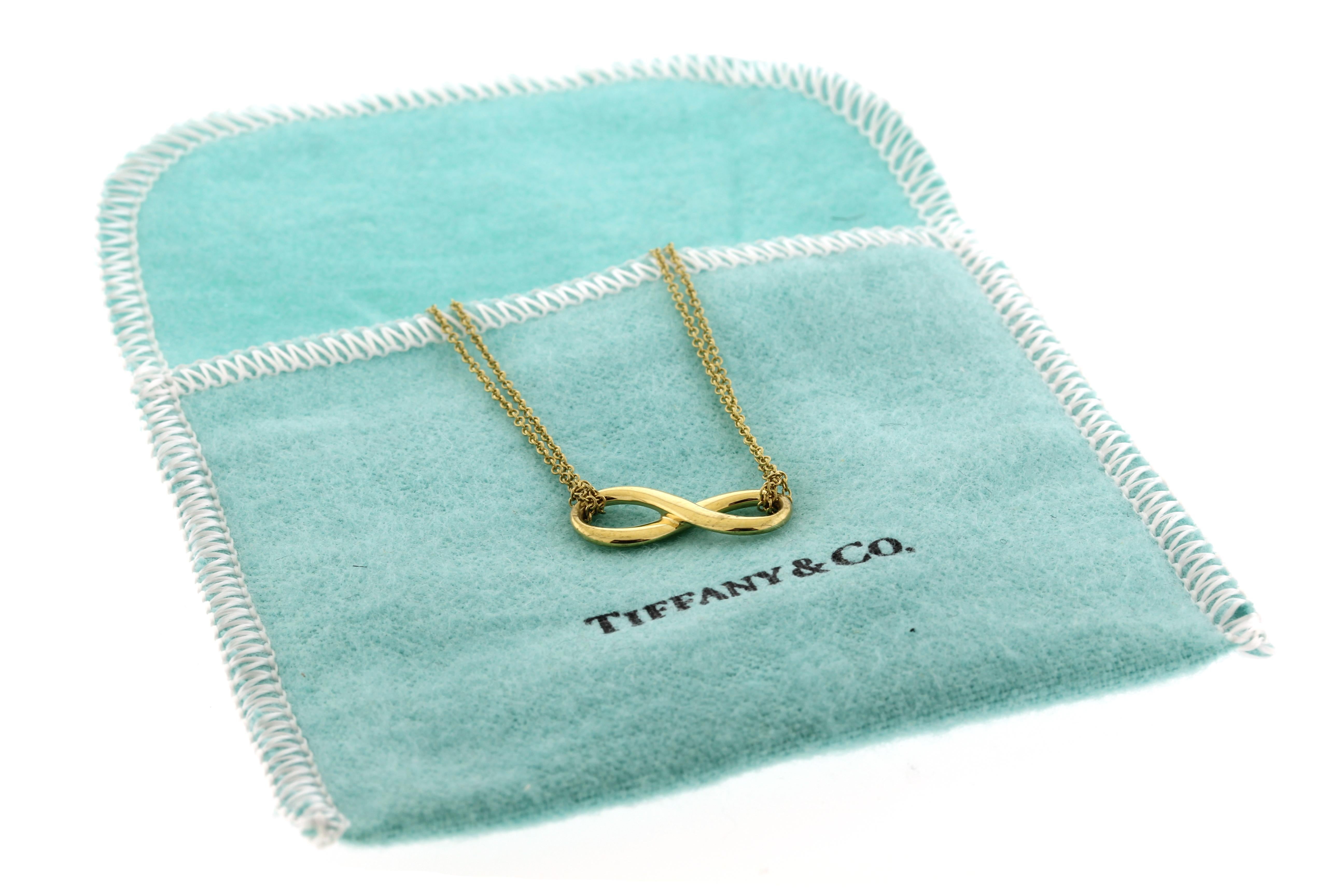 From Tiffany & Co, this infinity pendant necklace is 16 inches in length
• Metal: 18kt Yellow Gold
• Circa: 2010s
• Size: 20.02mm x8.2mm 
• Packaging: Tiffany pouch
• Condition: Excellent Condition