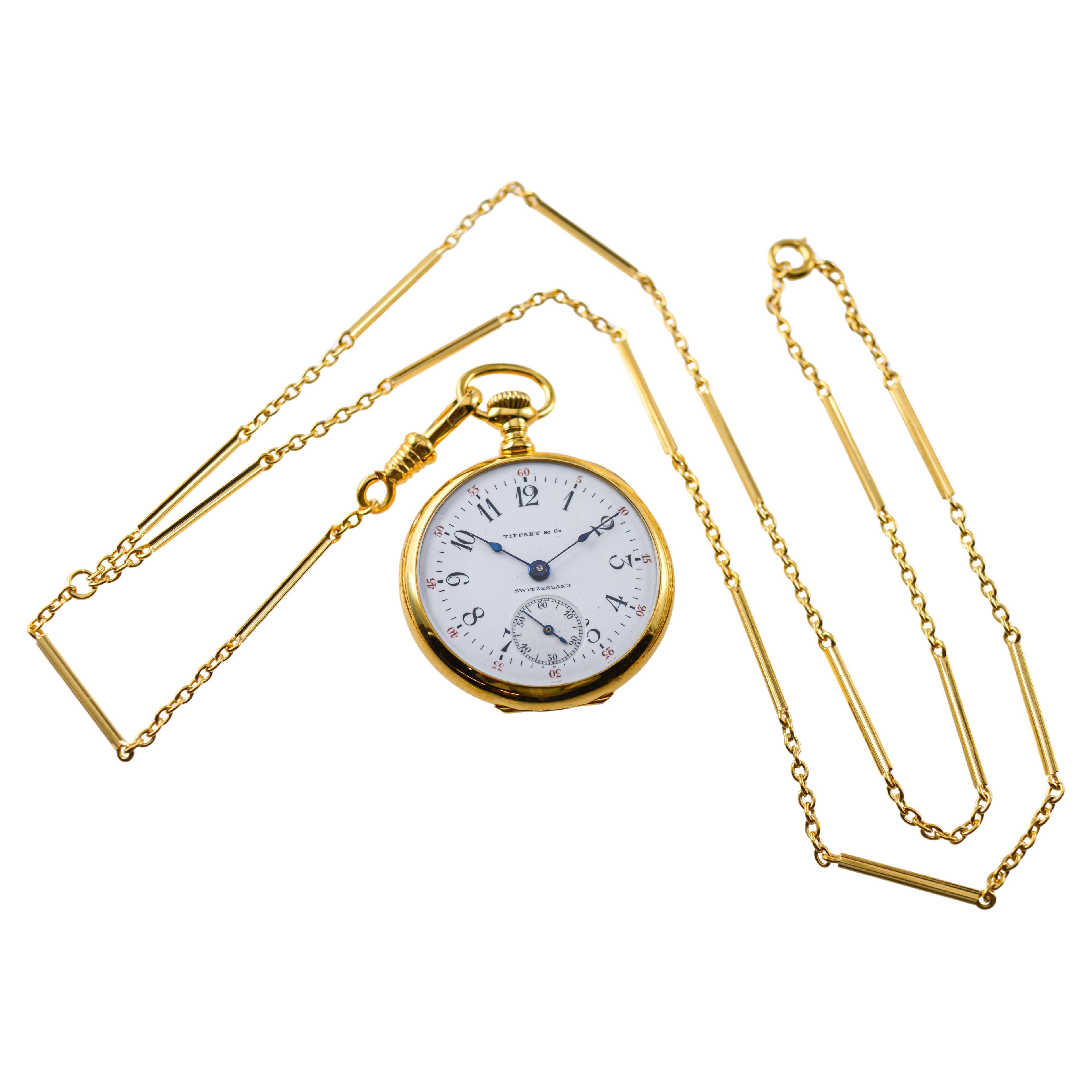 FACTORY / HOUSE: Longines for Tiffany & Co
STYLE / REFERENCE: Art Deco / Pendant Watch & Chain
METAL / MATERIAL: 18Kt. Yellow Gold
CIRCA / YEAR: 1912
DIMENSIONS / SIZE: Diameter 29mm
MOVEMENT / CALIBER: Manual Winding / 15 Jewels / Longines  
DIAL /