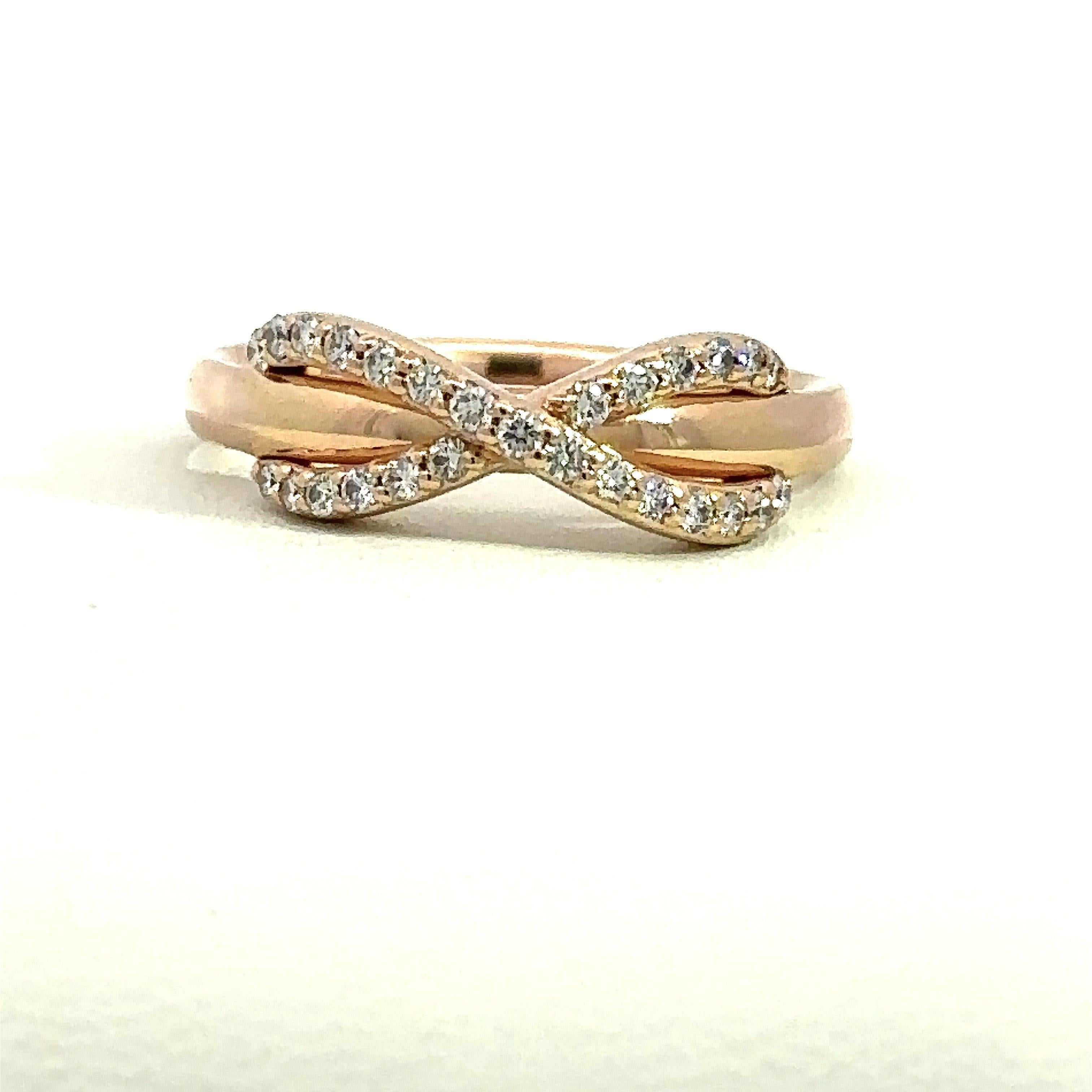Tiffany & Co. Diamond Infinity Ring in 18KT rose gold with twenty-seven diamonds that weigh approximately .16CT. The ring is stamped T&Co. AU750 Italy. The ring measures 5.7mm at its widest point and tapers to 2.3mm. The ring is a size 5 and can be