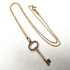 Tiffany & Co. 18Kt Rose Gold Key Pendant with Chain  Elegant and timeless