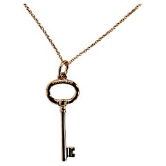 Tiffany & Co. 18Kt Rose Gold Key Pendant with Chain  Elegant and timeless