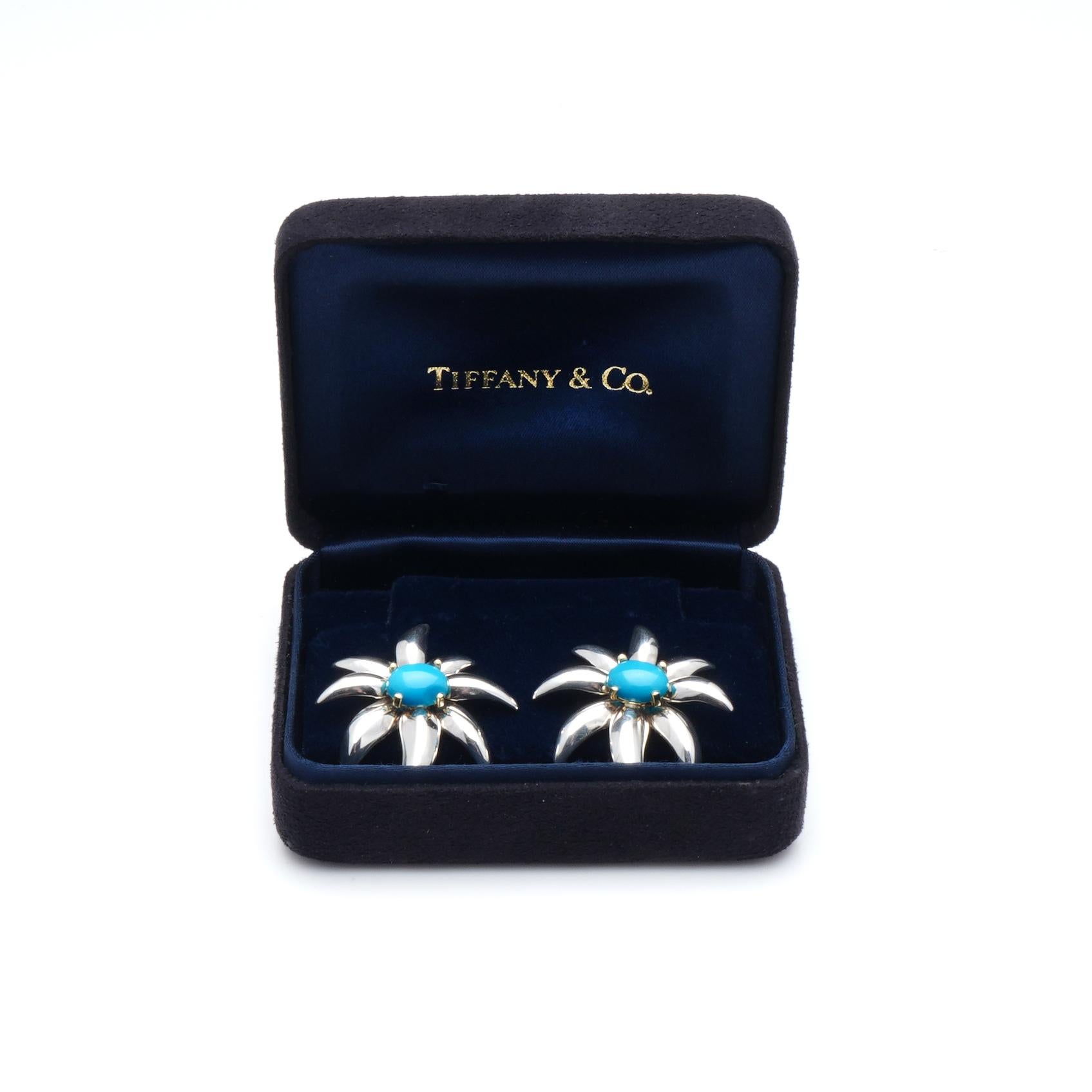 Tiffany & Co. 18kt. yellow gold and 925 silver clip - on fireworks earrings, set with turquoise at the centre.   
Made in USA, 1995
Fully hallmarked.

The Fireworks earrings date to 1995 and are no longer available for sale at Tiffany. 
The