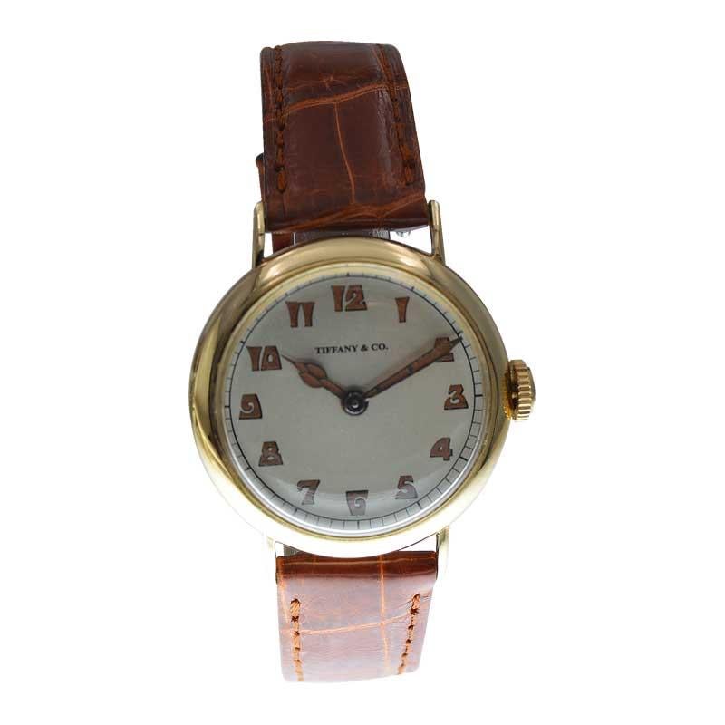 FACTORY / HOUSE: International Watch Company / Tiffany & Co.
STYLE / REFERENCE: Campaign Style 
METAL / MATERIAL: 18Kt. Yellow Gold 
CIRCA / YEAR: 1920's
DIMENSIONS / SIZE: Length 38mm X Diameter 31mm
MOVEMENT / CALIBER: Manual Winding / 17 Jewels