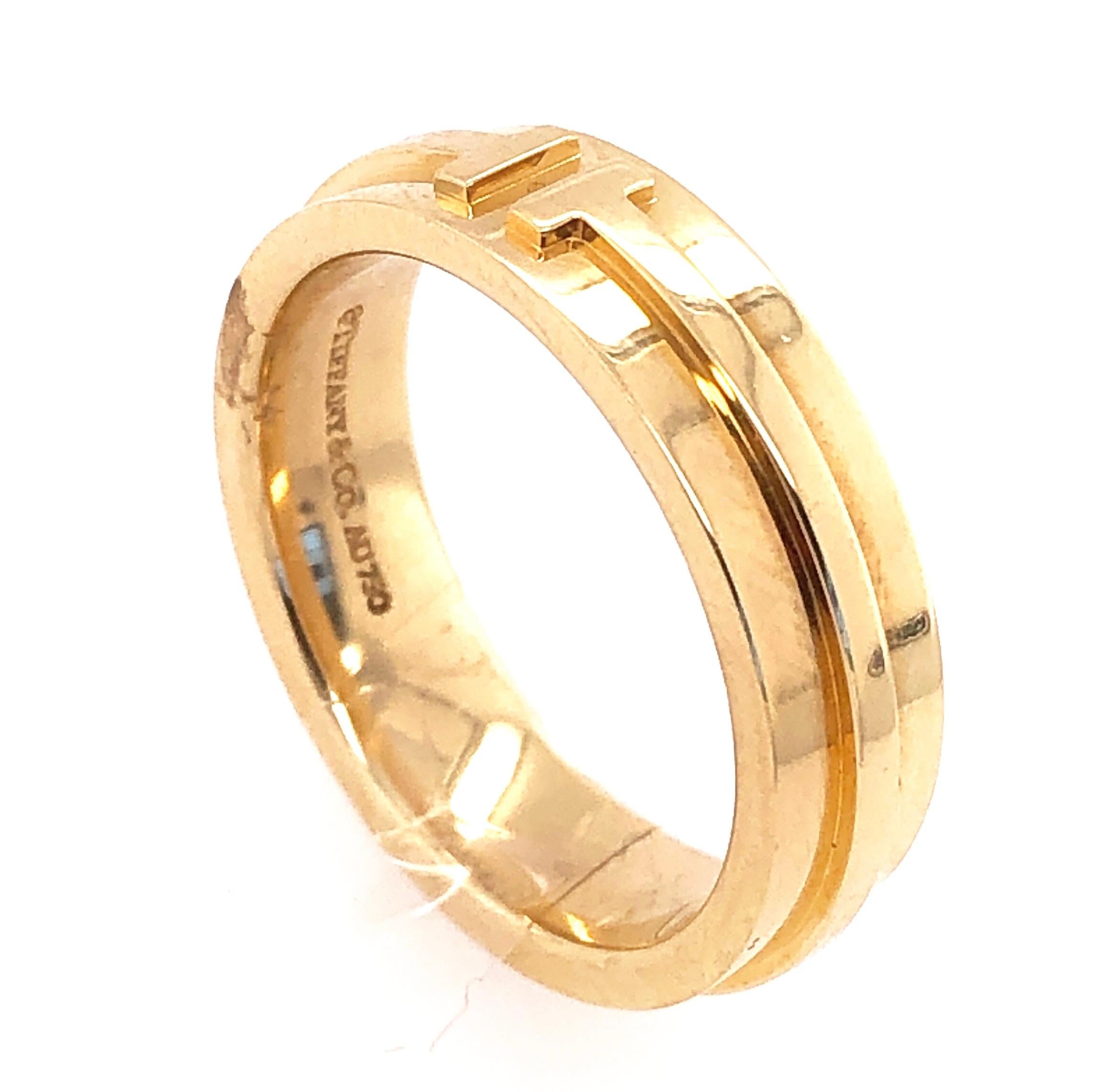 Tiffany & Co. 18Kt Yellow Gold Wedding Ring/ Band. Stamped AU750
Size 8 with 11 grams total weight.