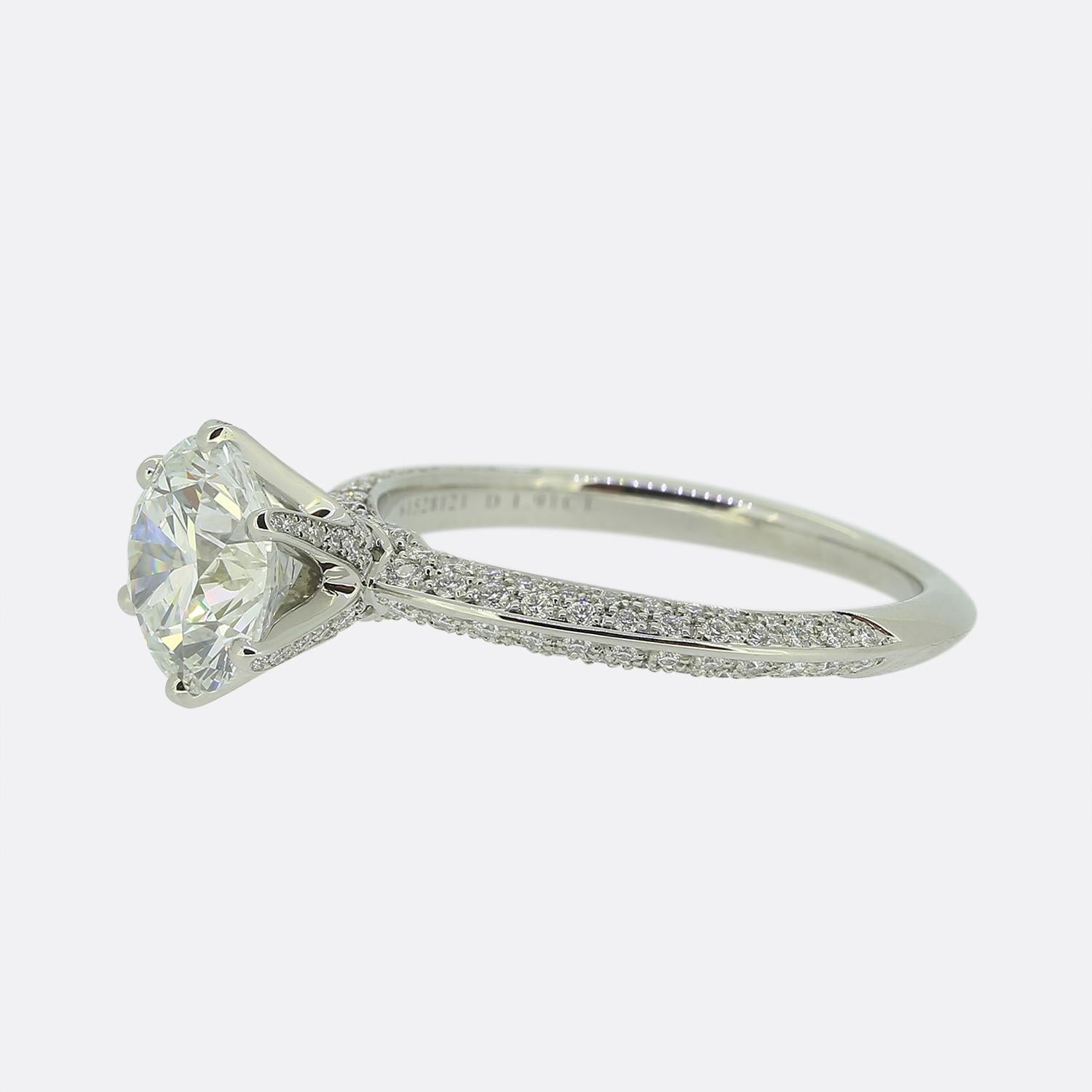 This is a truly special ring from the luxury jewellery designer Tiffany & Co. The ring features an F colour, VVV2 clarity, 1.91 carat round brilliant cut diamond in the centre. It sits in Tiffany's iconic six claw mount but the band, shoulders and