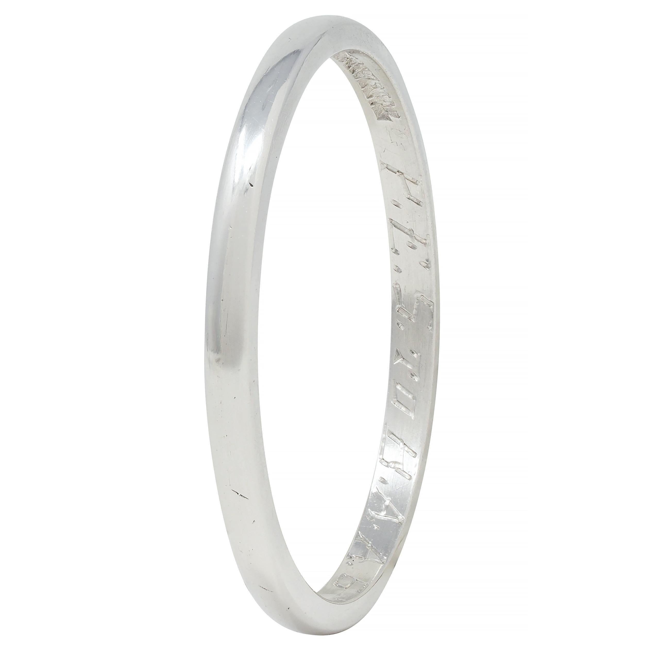 Designed as a sleek minimal band 
Featuring squared off edges
With high polish finish
'Inscribed P.E.S. to B.A.A. 6-25-23'
Tested as platinum
Fully signed for Tiffany & Co.
Circa: 1923; via dated inscription
Ring size: 7 1/2 and sizable with