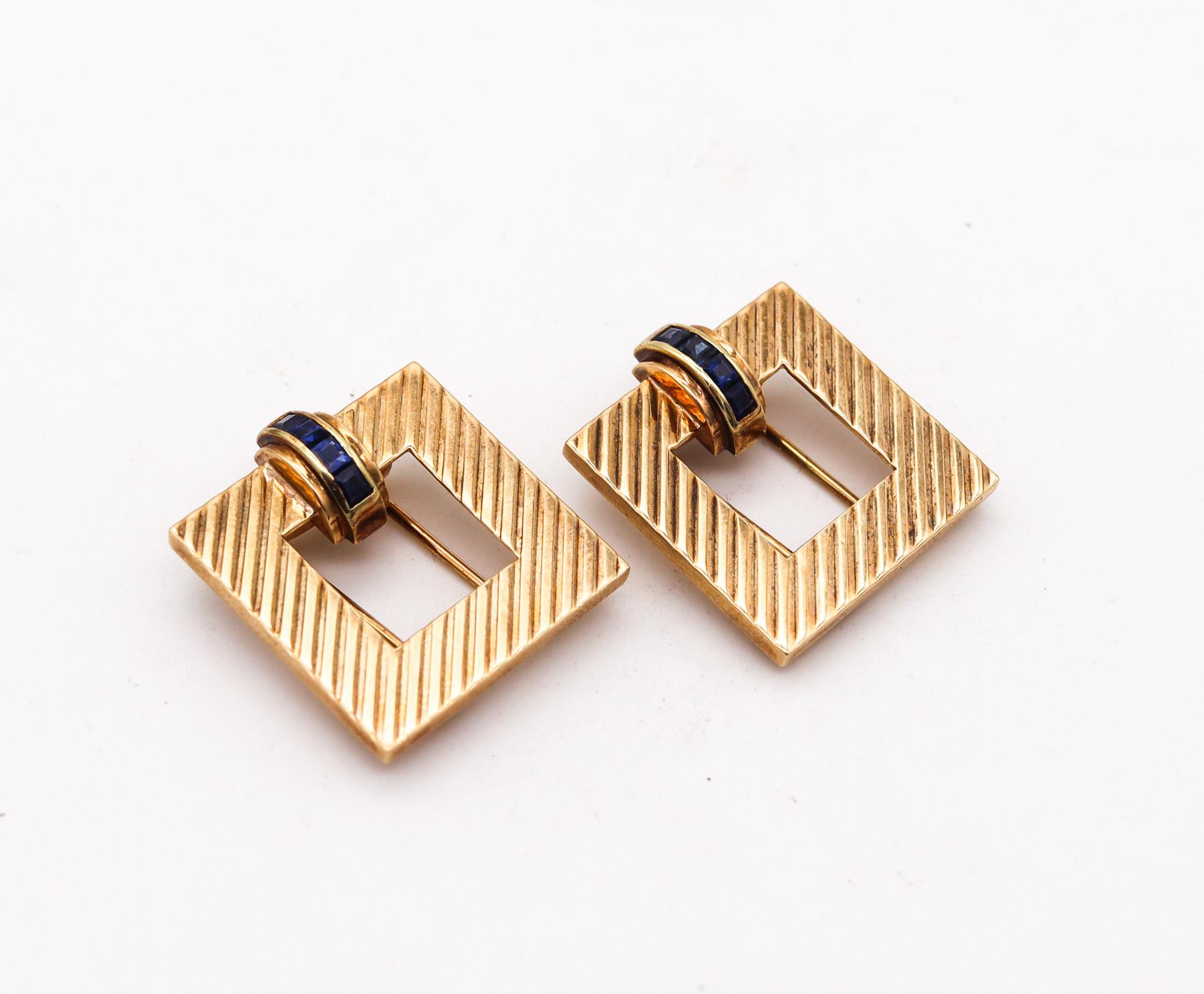 Pair of dress clips designed by Tiffany & Co. 

A beautiful pair of dress clips, created in New York city at the Tiffany Studios during the late art deco period, circa 1940. These dress clips has been carefully crafted with retro and machine age