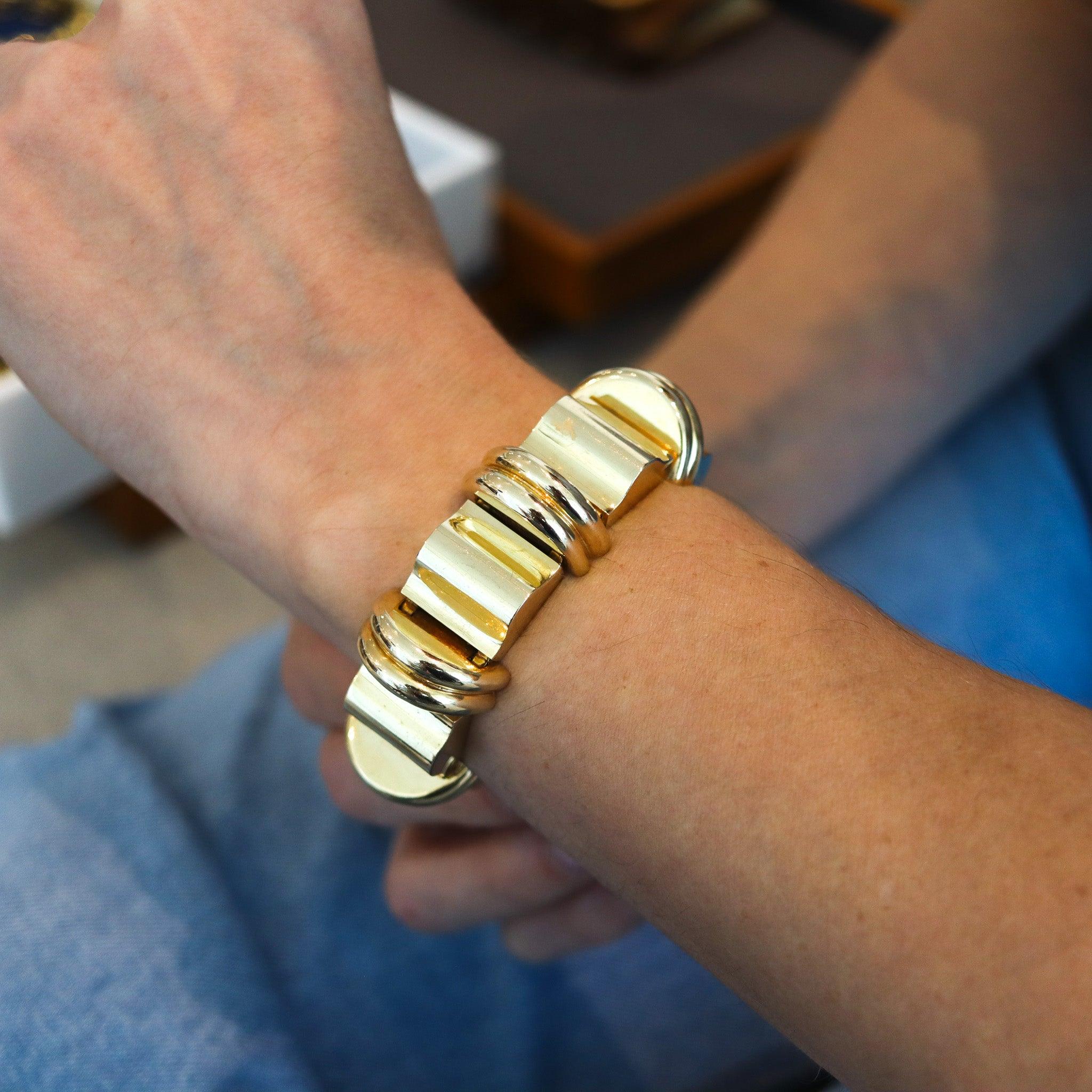 A geometric bracelet designed by Tiffany & Co.

A beautiful bold bracelet, created in New York City by Tiffany & Co. back in the 1950. The bracelet has been crafted with retro modernist patterns in solid yellow gold of 14 karats with high polished