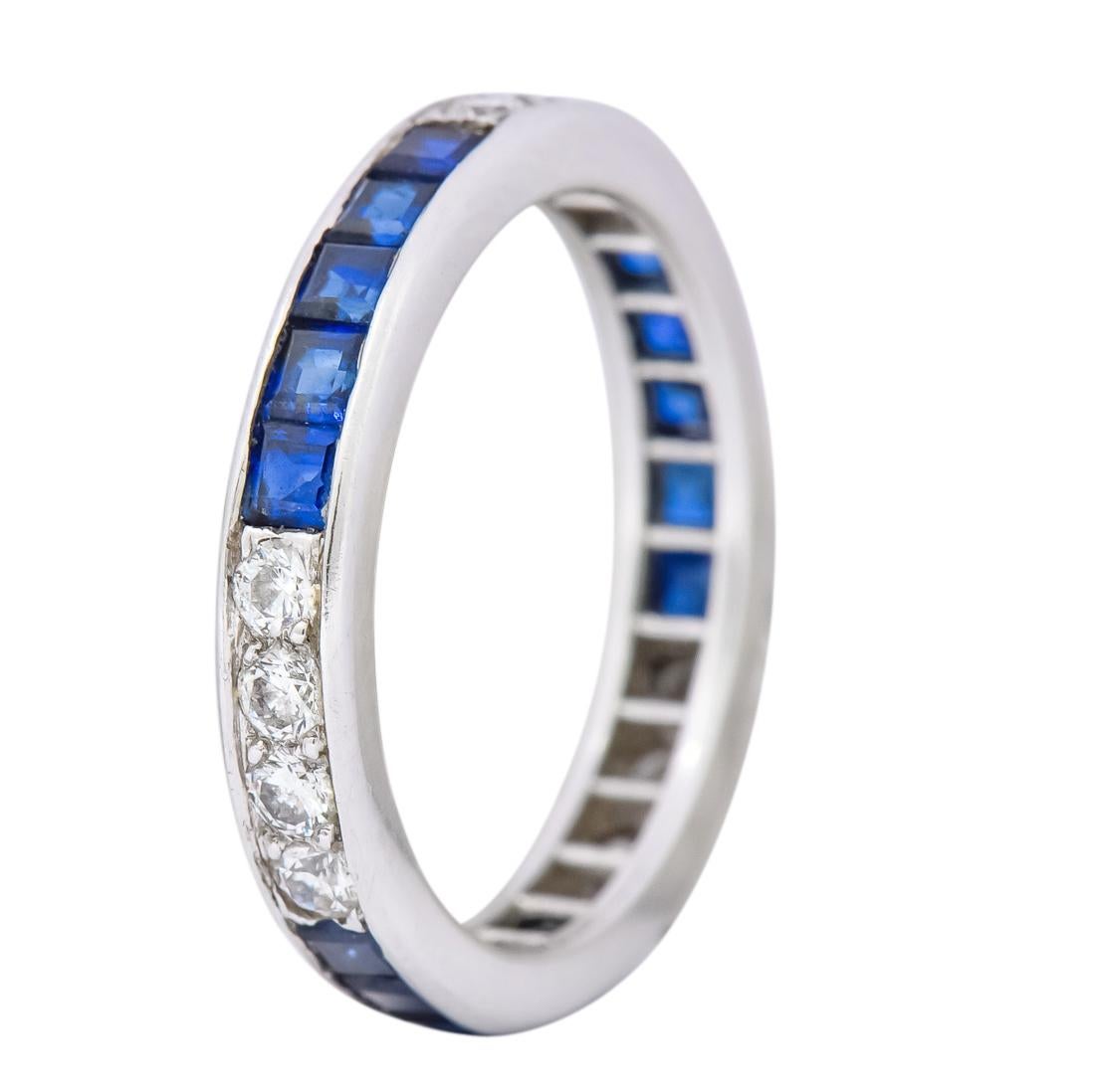 Eternity style band with polished channel edges

Channel set with square cut sapphires weighing approximately 1.00 carat total, inky blue in color and very well matched

Alternating with bead set round brilliant cut diamonds 0.42 carat total, G/H