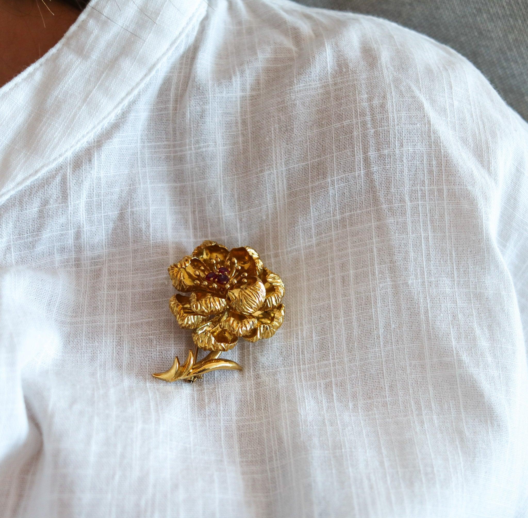 Flower brooch designed by Tiffany & Co.

This is a beautiful three-dimensional flower brooch, created by the jewelry house of Tiffany & Co., back in the 1960. The vintage brooch has been crafted in the shape of a large flower in solid rich yellow