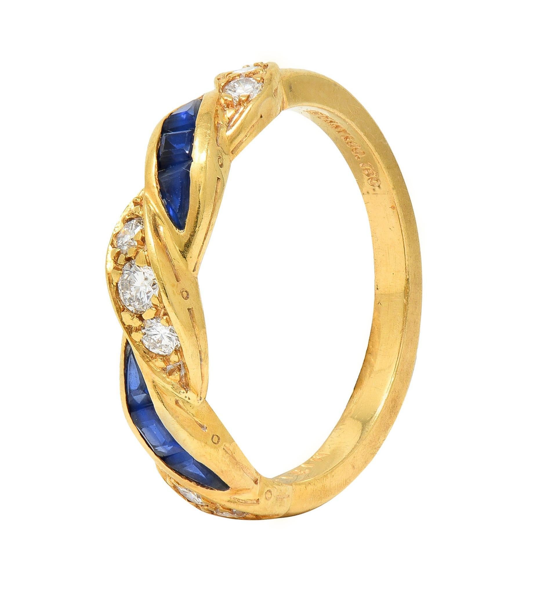 Centering as a gold twist motif with alternating rows of channel set diamonds and sapphires
Round brilliant cut diamonds weigh approximately 0.23 carat total - G color and VS2 clarity
Sapphires are calibré step cut and  weigh approximately 0.32