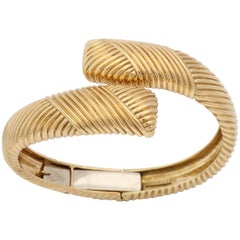 Tiffany & Co. 1960s Stylish Ridge Textured Gold Crossover Hinged Bangle Bracelet