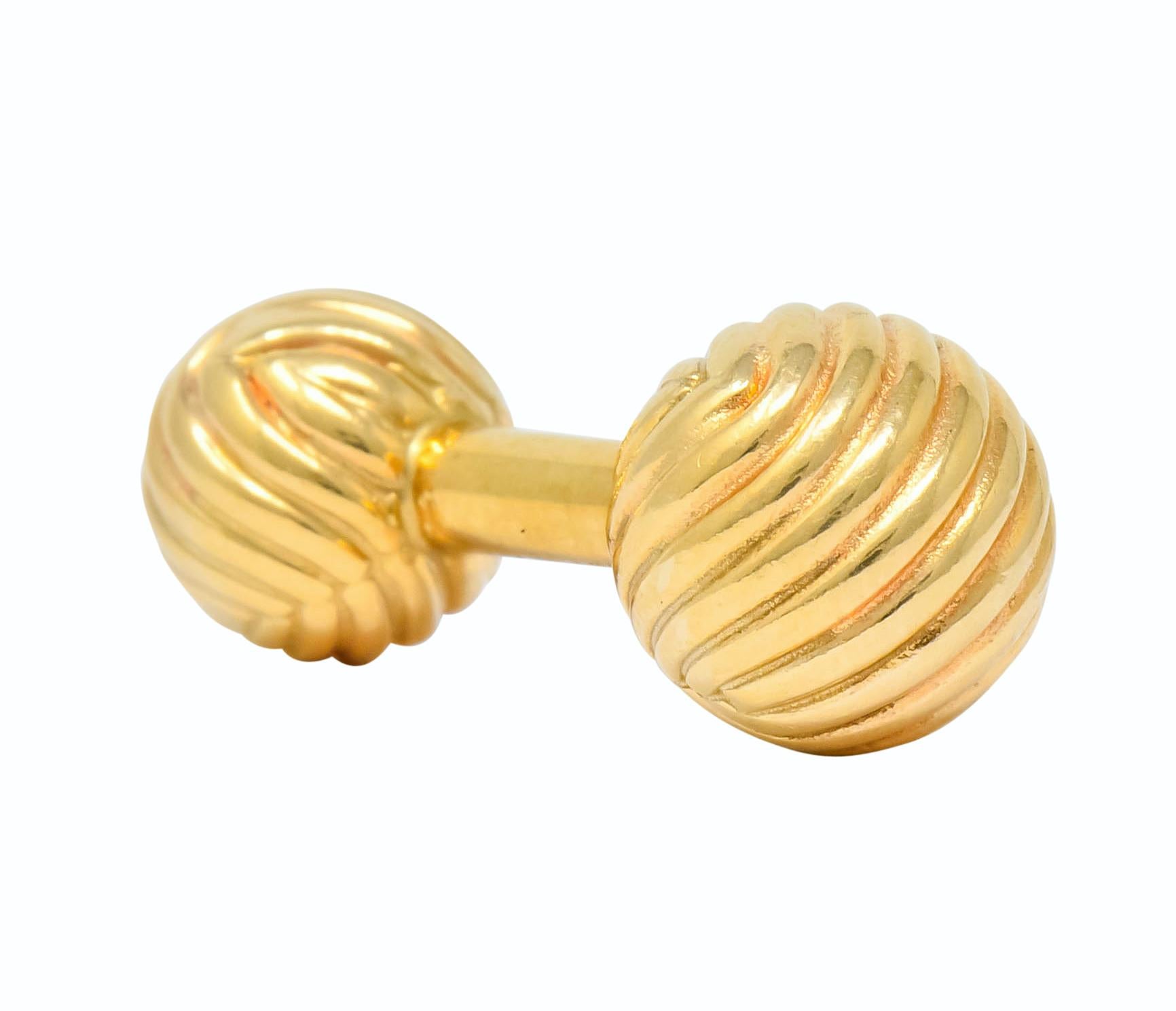 Bar style cufflinks with a ball on each end, one small and one large, deeply ridged with a grooved texture

Larger ball measuring 11.0 mm and smaller ball measuring 9.7 mm

Central bar fully signed Tiffany & Co.

Stamped 14kt for 14 karat