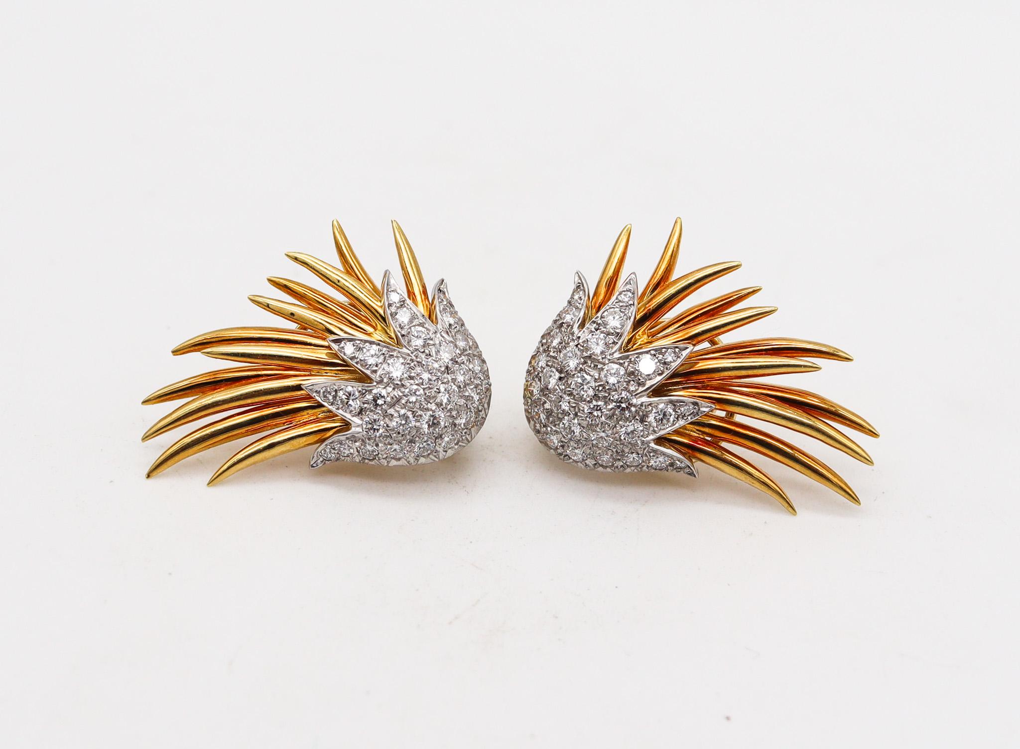 Clips earrings designed by Tiffany & Co.

An iconic pair of earrings created in New York city by the Tiffany Studios, back in the 1970's. This pair was crafted with spiky flames patterns, made up in solid yellow gold of 18 karats and platinum parts