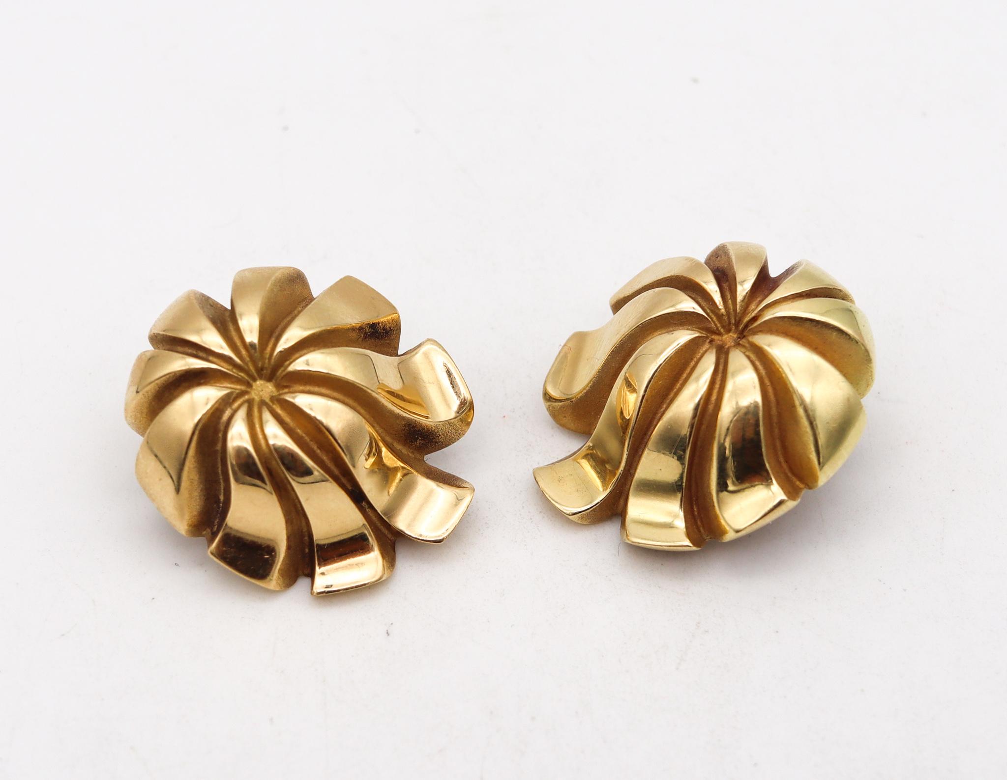 Chrysanthemum earrings designed by Tiffany & Co.

Beautiful vintage pieces created in New York city at the Tiffany Studios, back in the late 1970's. These sculptural clip earrings has been crafted with japonisme patterns in the shape of