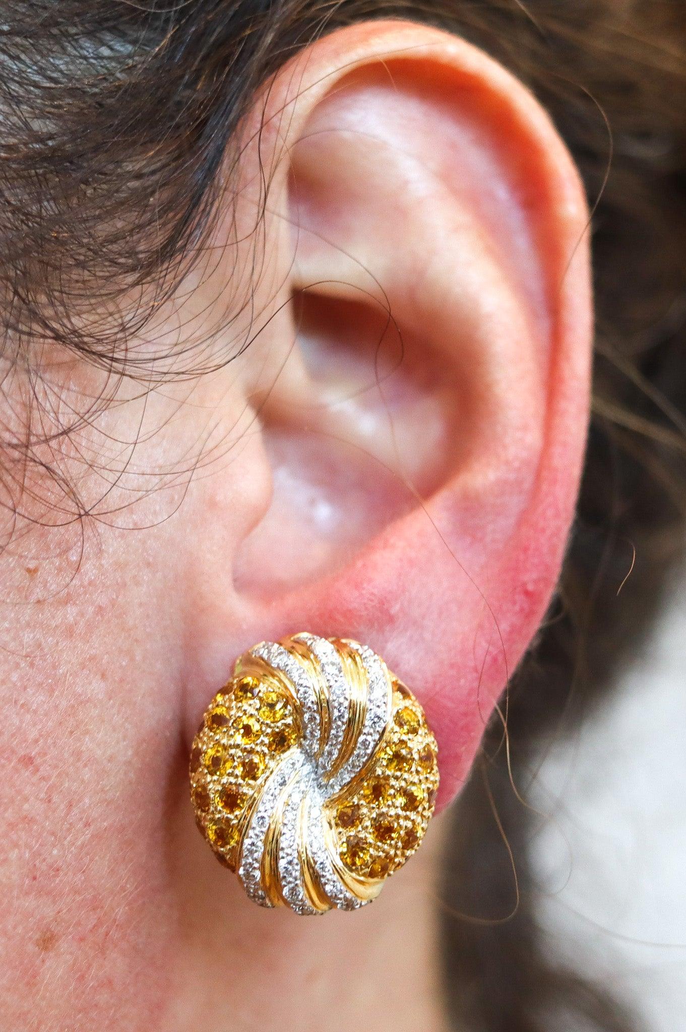 Clips-on earrings designed by Jean Schlumberger for Tiffany & Co.

This is a beautiful pair of clips-on earrings, created in New York city by Jean Schlumberger for Tiffany & Co, back in the 1970. The exceptional earrings were crafted in oval bombe