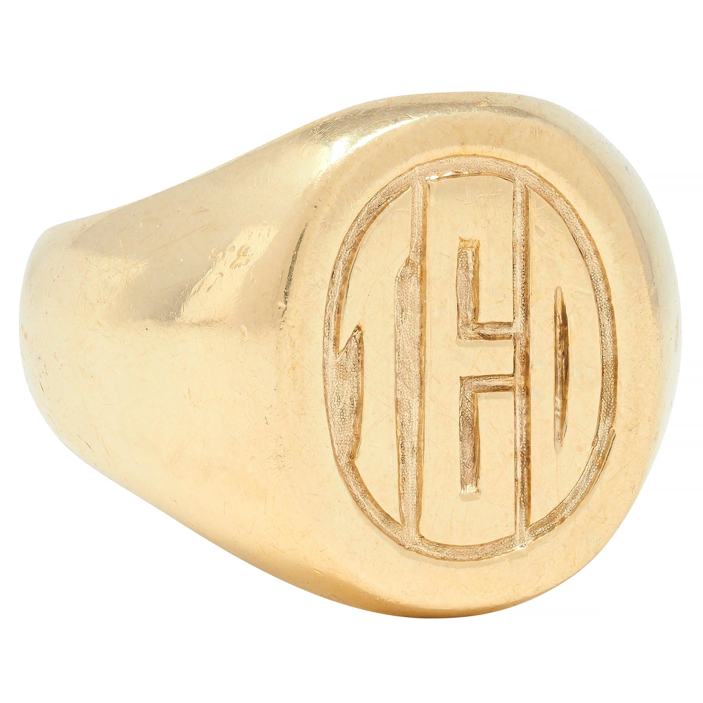 Centering an oval-shaped face engraved with stylized text
Depicting the name 'TED' with grooved surround 
With rounded shoulders and high polish finish
Tested as 14 karat gold
Fully signed for Tiffany & Co. 
Circa: 1970s
Ring size: 9 1/4 and sizable