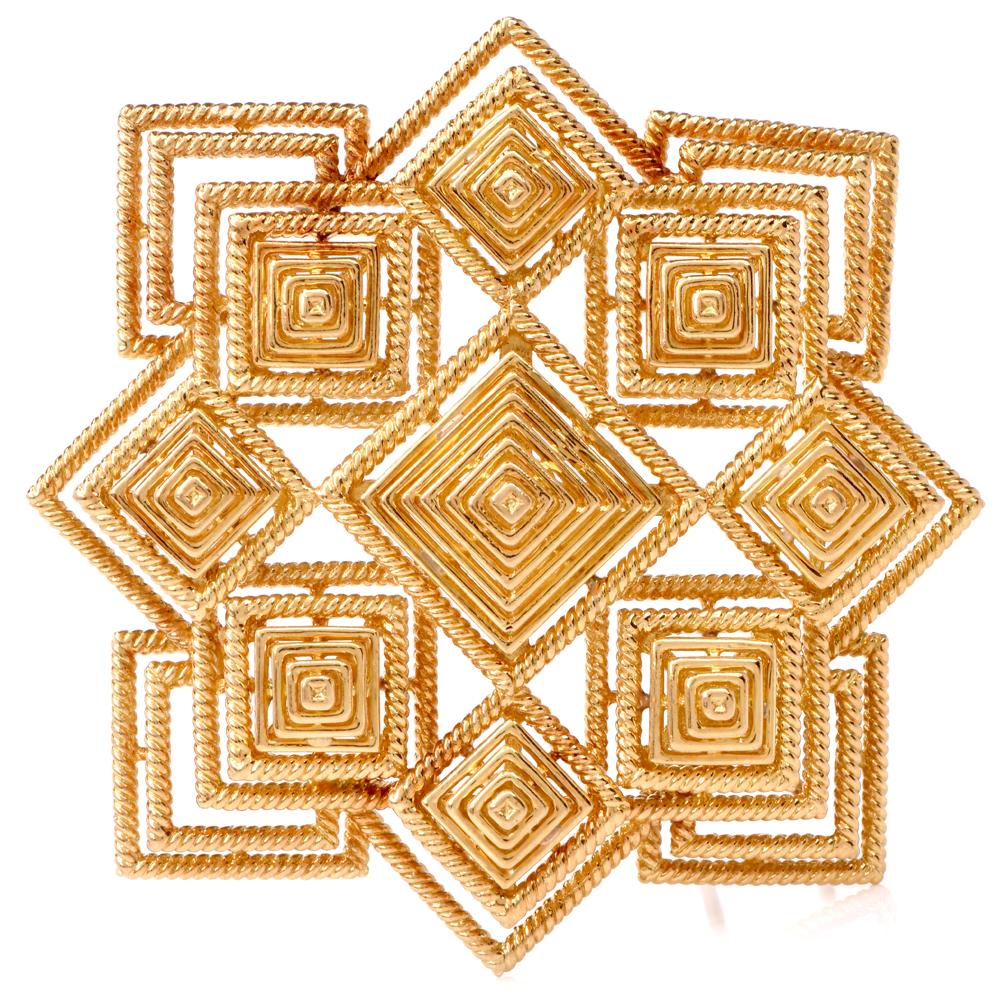 This authentic Tiffany & Co. 1970s lapel brooch and pendant of bold and sensational aesthetic and artistic workmanship is crafted in 18 karat yellow gold and incorporates a total number of 9 pyramidal profiles, the largest positioned at the center,