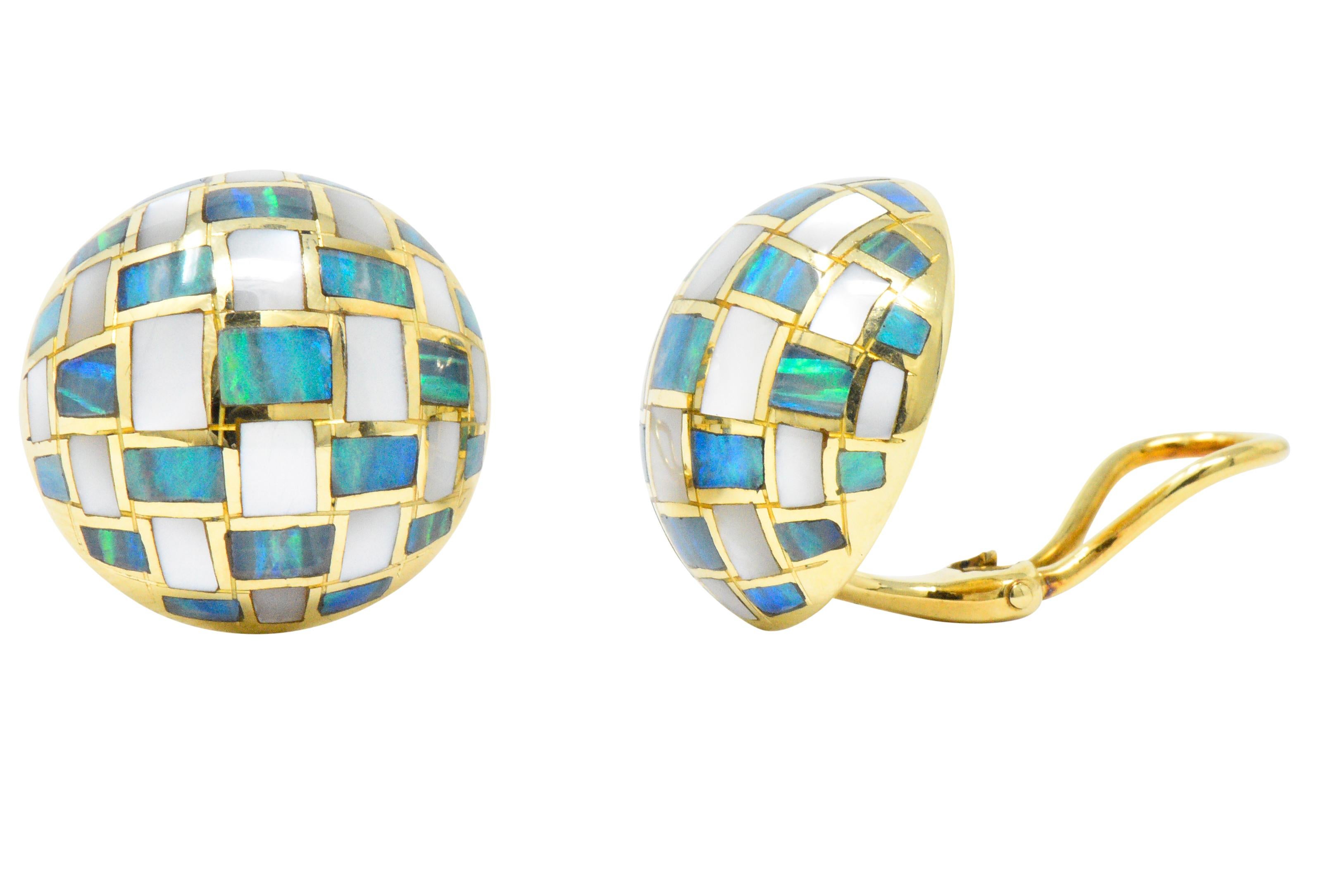 Round domes with inlayed mother of pearl and black opal

Abstract checkerboard motif

Hinged omega backs

Signed T&Co

Circa 1970's

Tested as 18 karat gold

Diameter: 19.7 mm

Total Weight: 13.5 Grams

Chic. Sophisticated. Classy.
 

 

Stock