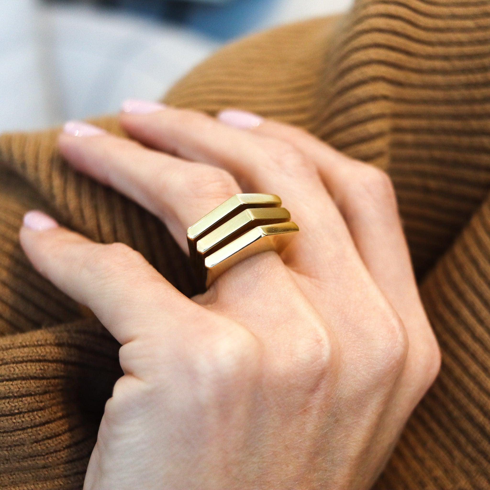 Geometric ring designed by Don Berg for Tiffany & Co.

This is a fabulous sculptural cocktail ring, created by Don Berg for the Tiffany & Co., back in the 1973. This geometric ring is very rare and has been crafted in substantial solid yellow gold