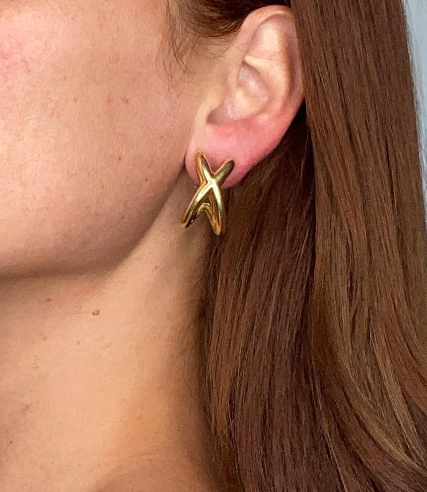 Pair of crisscross earrings designed by Donald Claflin for Tiffany & Co.

A classic three-dimensional pair with two oversized x crossover. These earrings were crafted at the Tiffany studios by Donald Claflin in solid yellow gold of 18 karats, with