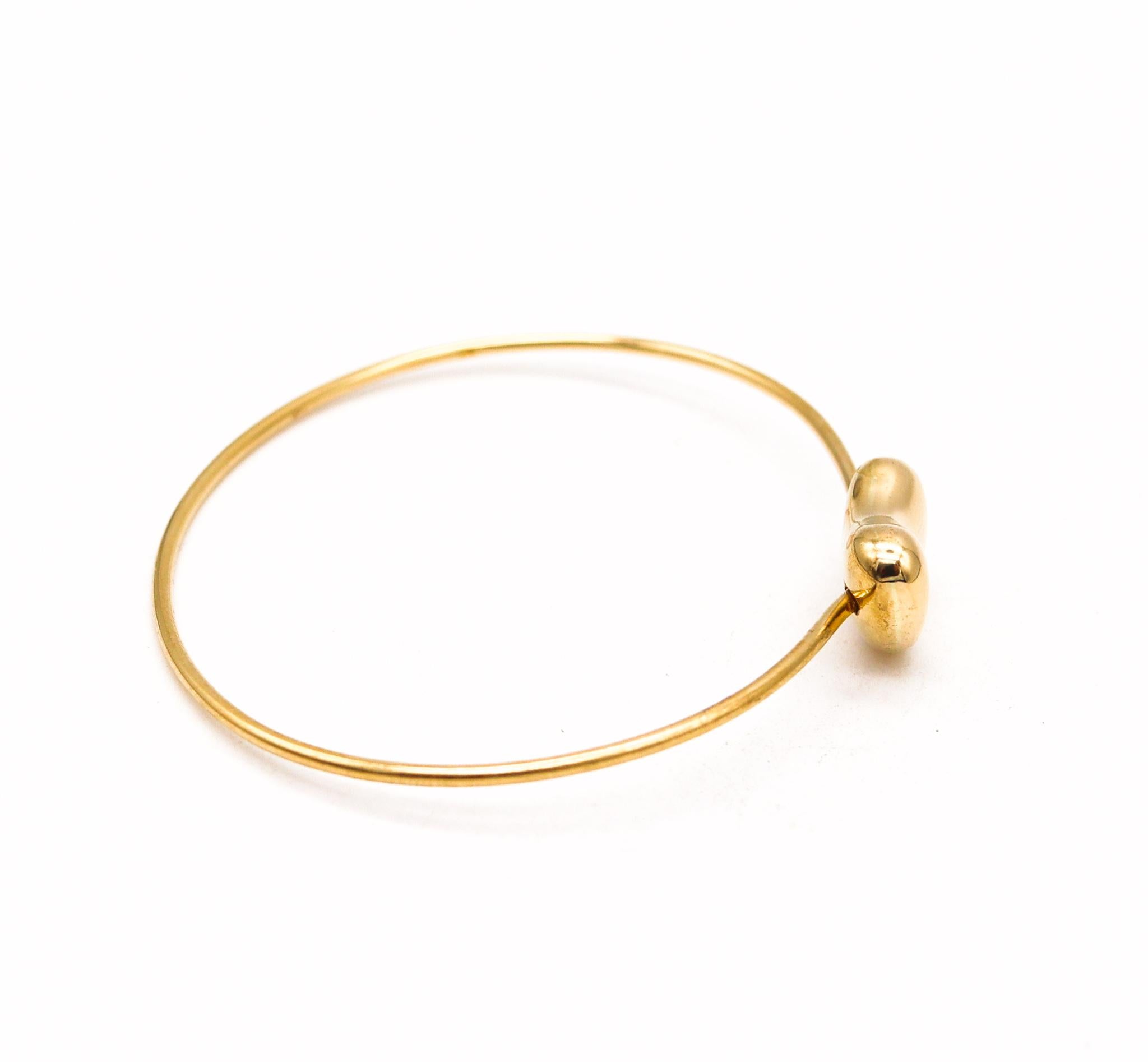 Modernist Tiffany & Co 1977 Elsa Peretti Rare Bean Bangle Bracelet in 18Kt Yellow Gold