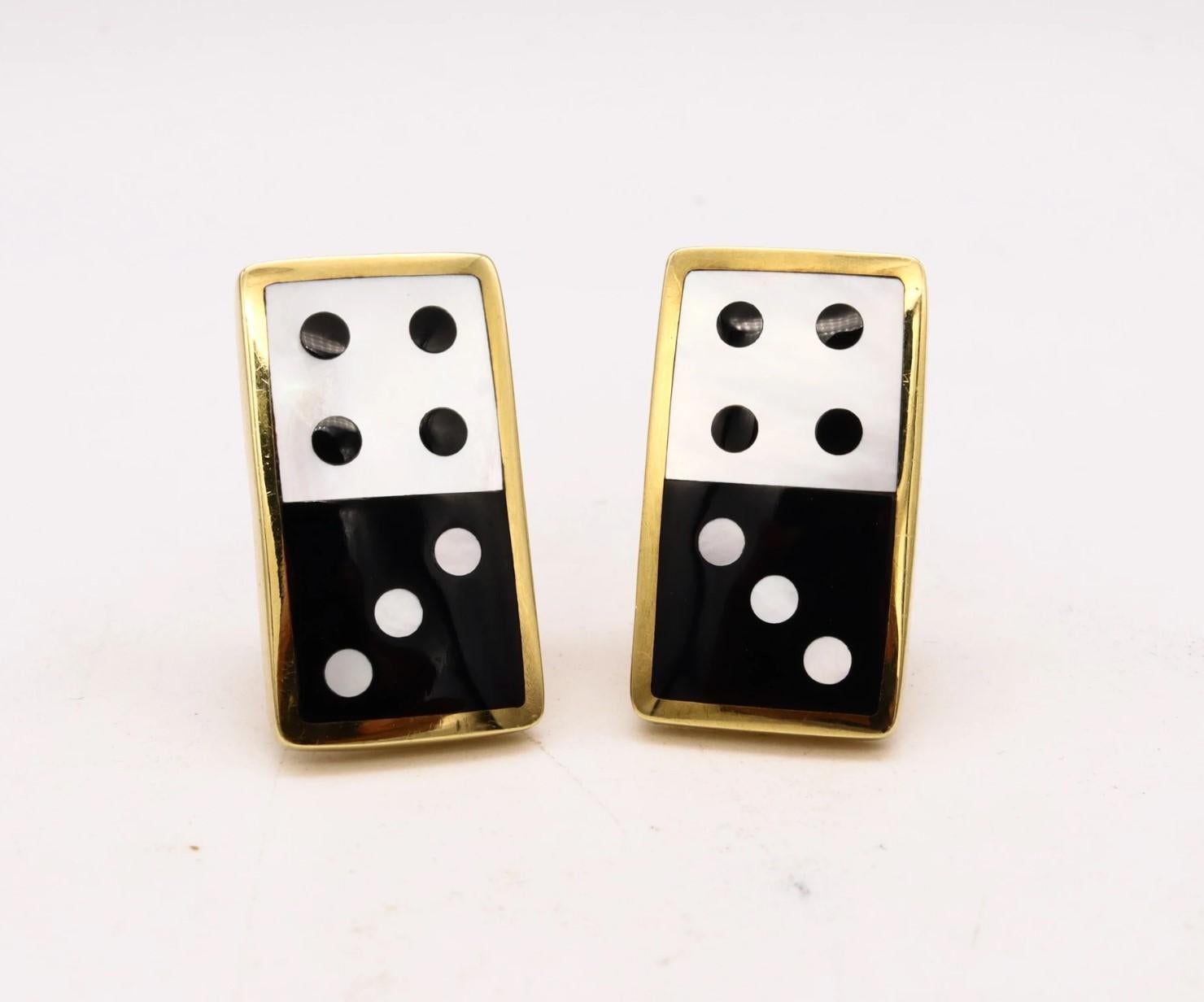 Domino earrings designed by Angela Cummings for Tiffany & Co.

This unusual domino pair of earrings was part of the Tiffany & Co. collection from the years of 1975 to 1978. They was crafted in solid 18 karats yellow gold and produced in very limited