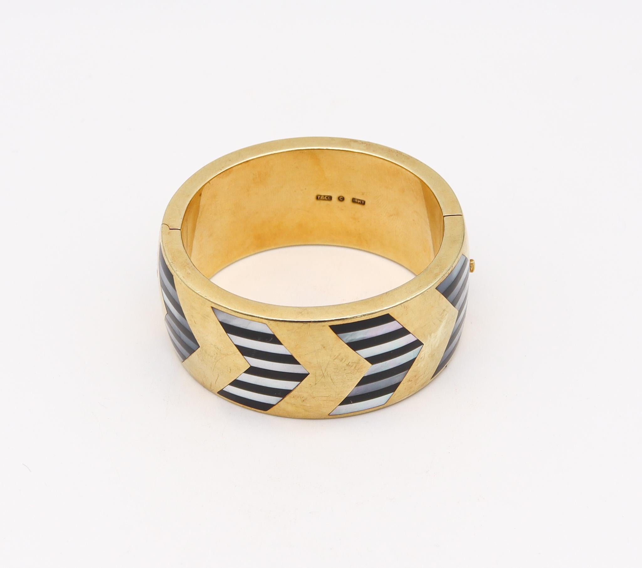 Modernist Tiffany & Co. 1978 Angela Cummings Geometric Bangle in 18Kt Gold with InlaidGems For Sale
