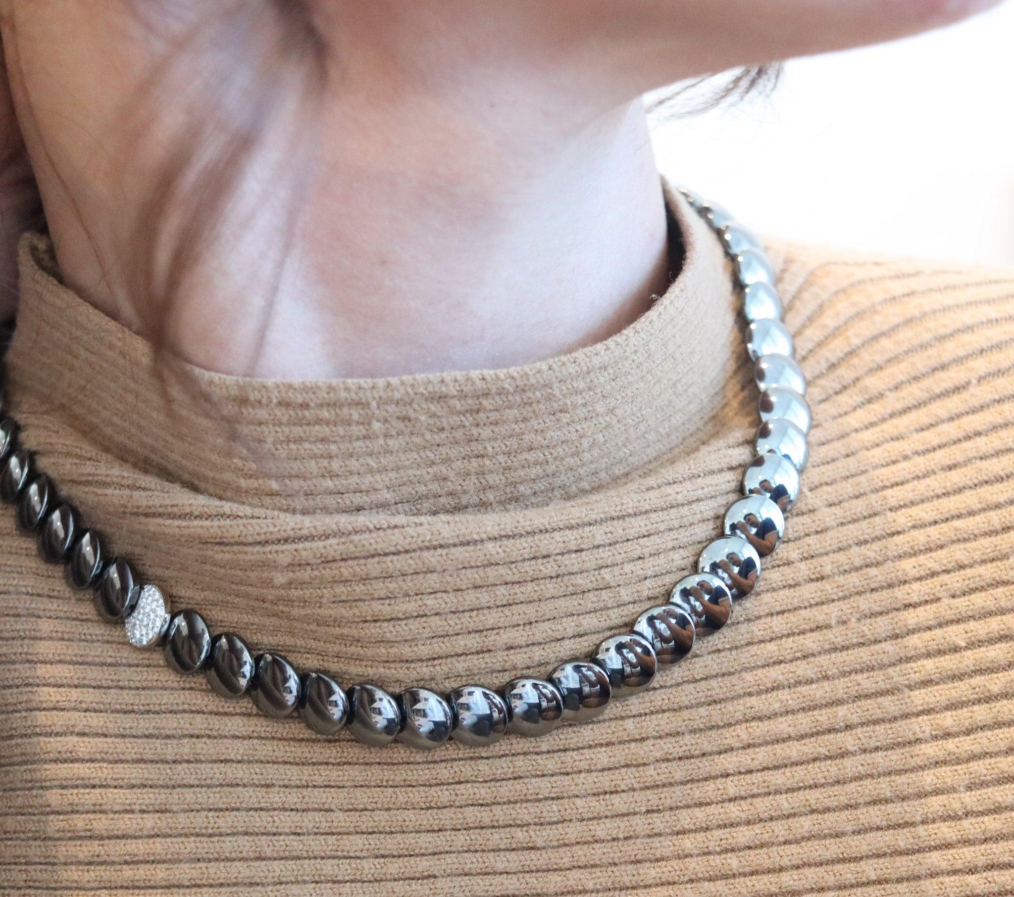 Lentils necklace designed by Angela Cummings for Tiffany & Co.

This very rare and elegant lentils necklace, was created in New York city by Angela Cummings for Tiffany & Co., back in 1980. This modernist necklace has been crafted with multiples