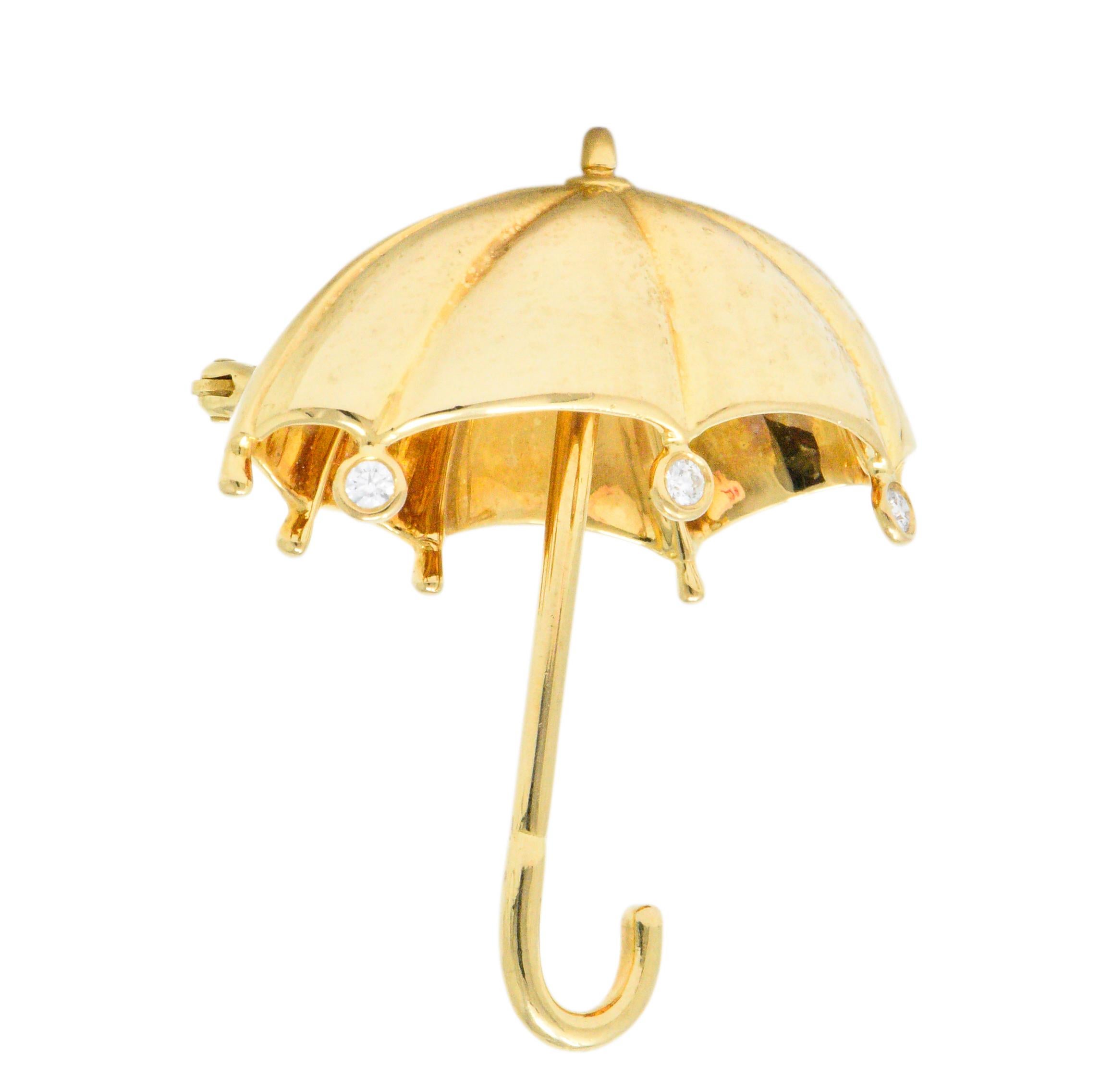 Designed as a demential umbrella with three bezel set round brilliant cut diamond accents, weighing approximately 0.18 carats total, G/H color and VS clarity
Polished gold details 
Perfect accessory for a rainy day
Fully signed Tiffany &