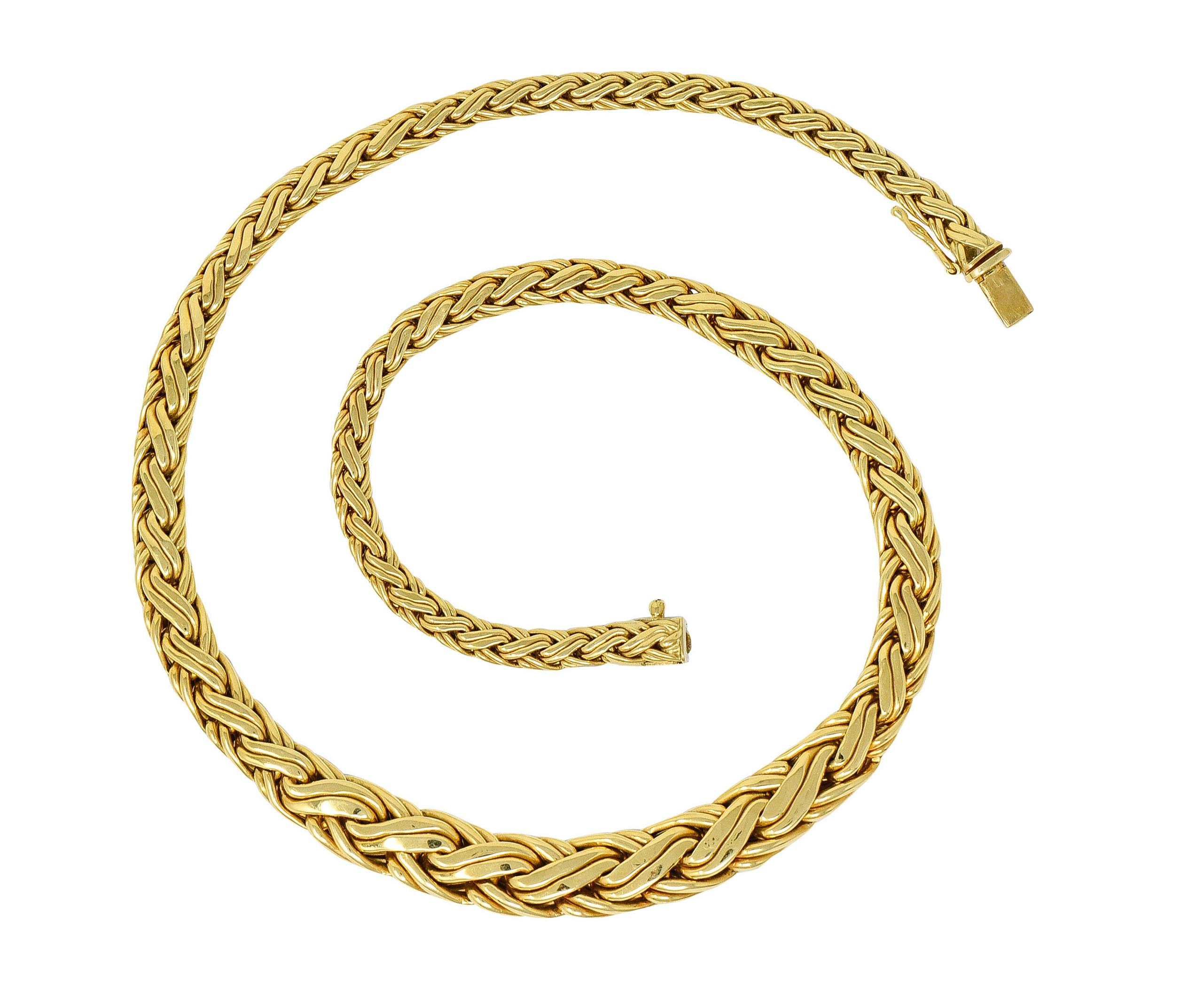 Collar style necklace is woven as a brightly polished wheat chain

Tightly braided links graduate in thickness, with a substantial center

Completed by a concealed clasp with a fold-over safety

Stamped 750 for 18 karat gold

Fully signed Tiffany &