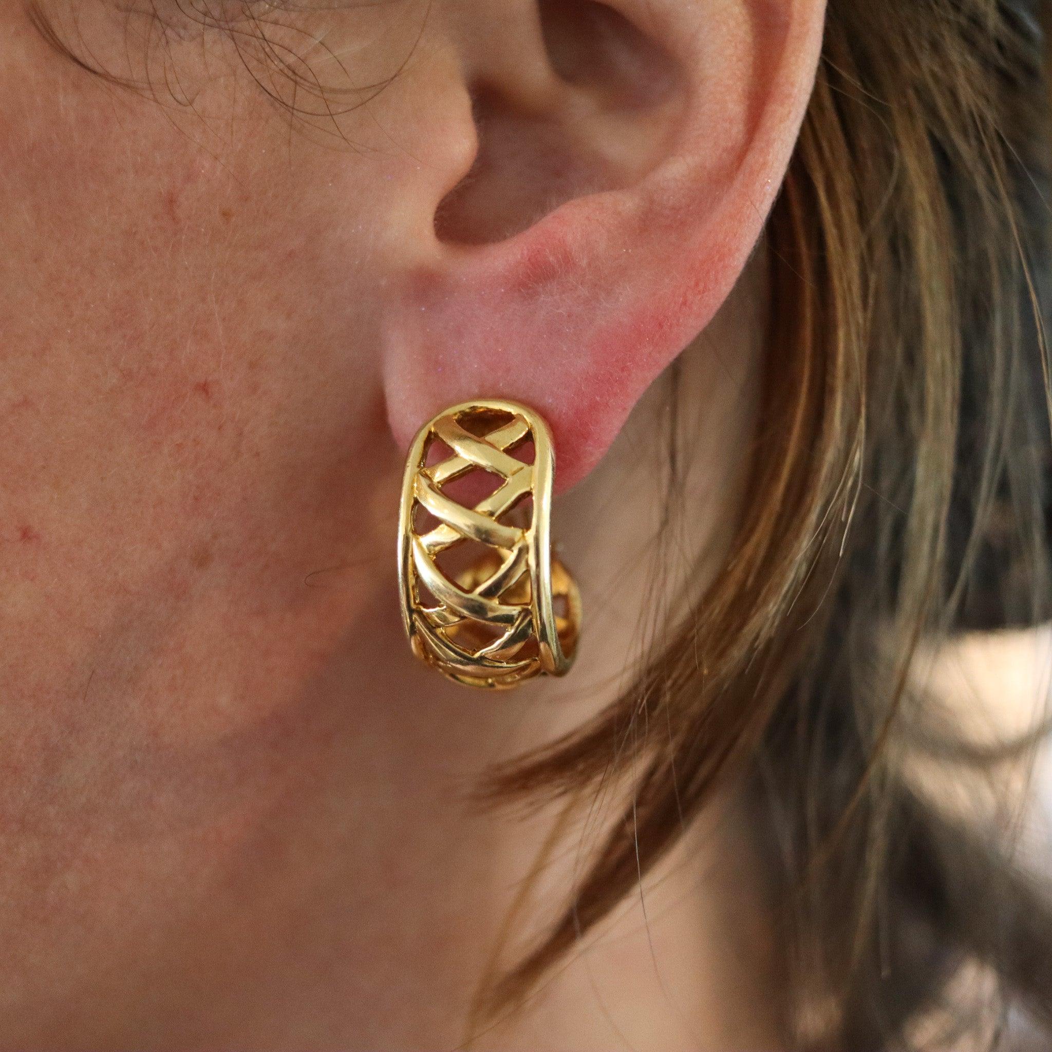 Hoops earrings designed by Paloma Picasso for Tiffany & Co.

This is a beautiful pair of hoops earrings, created in New York city by Paloma Picasso for Tiffany & Co., back in the 1980's. These hoops earrings were crafted with the iconic X's design