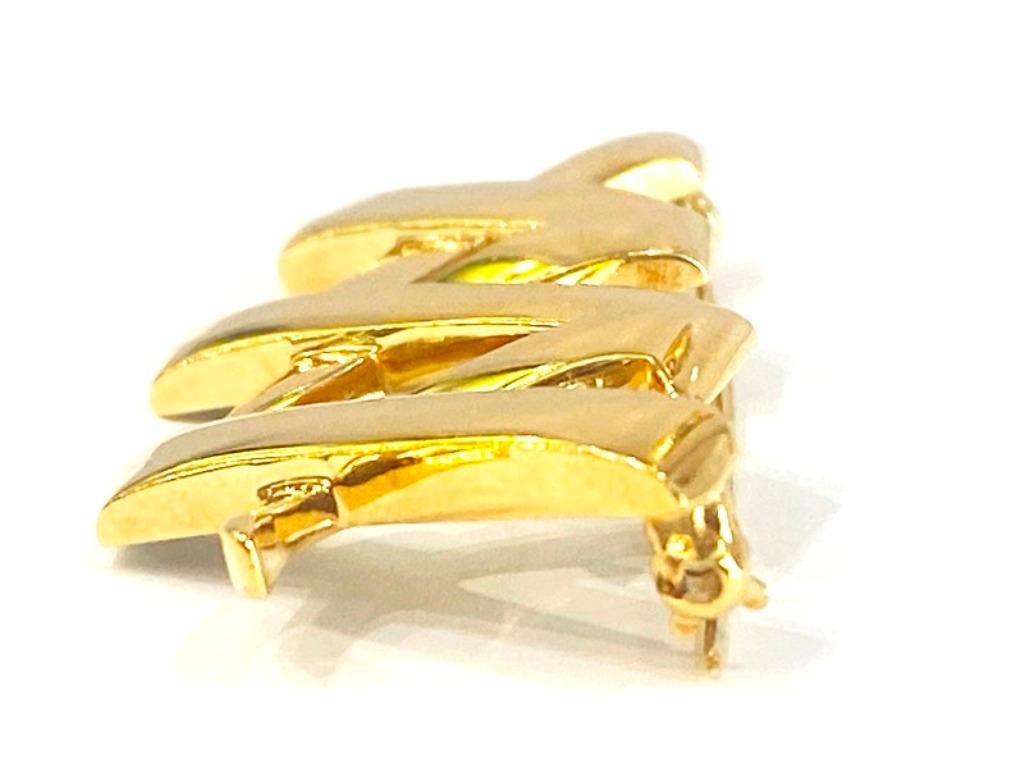 Tiffany & Co. Paloma Picasso Triple X Brooch 

Featuring Paloma Picasso's own handwritting, this expressive collection was inspired by graffiti scrawled on New York buildings. Make a sentimental statement with this 18KY gold b rooch!! 
Can be
