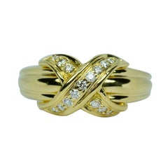 Tiffany & Co. 1990 Anello con diamante bianco rotondo a forma di X in oro giallo 18k