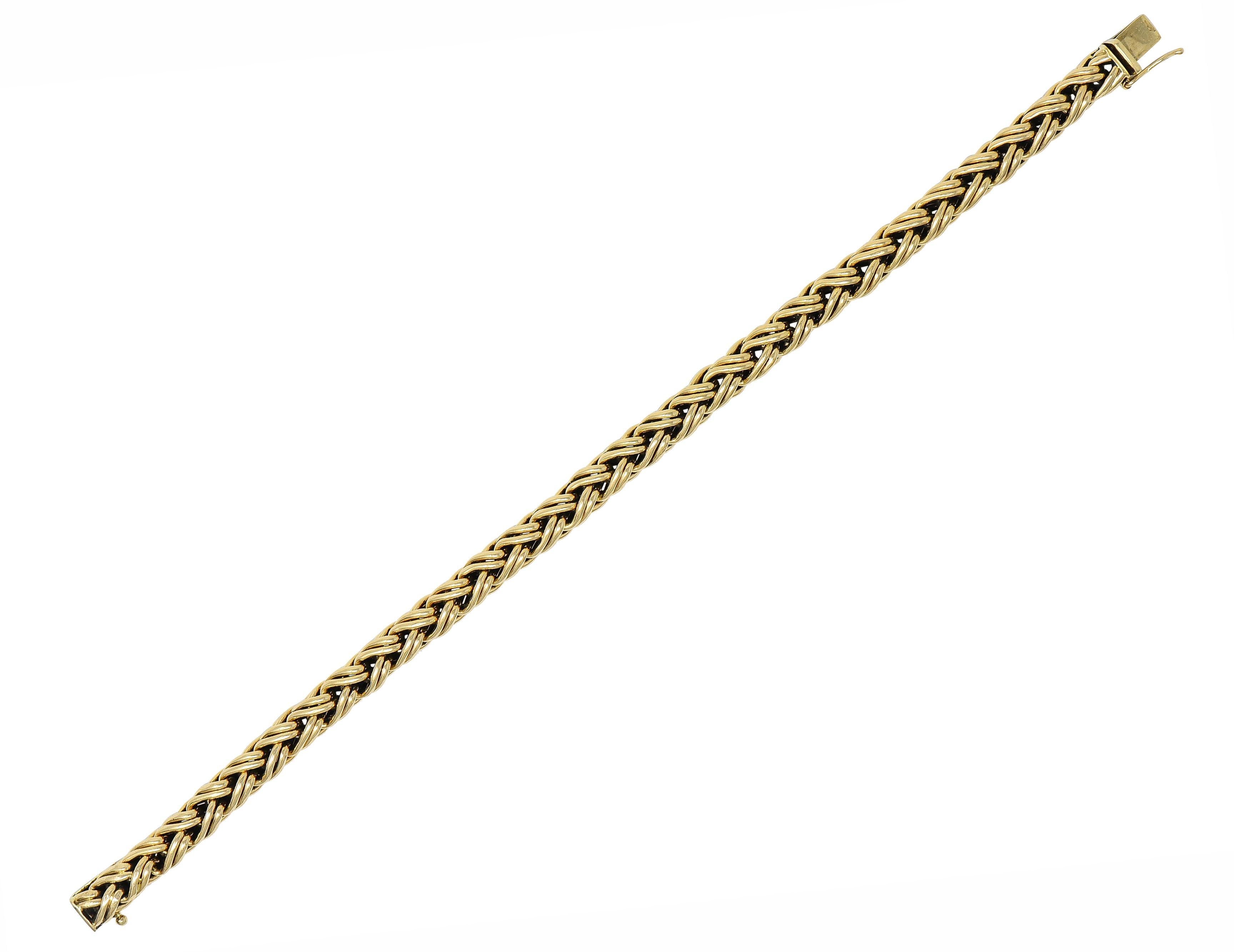 Designed as a uniform Russian weave chain 
Comprised of meshed weave motif links
With high polish finish
Completed by a concealed clasp closure
With figure eight safety
Stamped for 14 karat gold
Fully signed Tiffany & Co.
Circa: 1990's
Width: 1/4