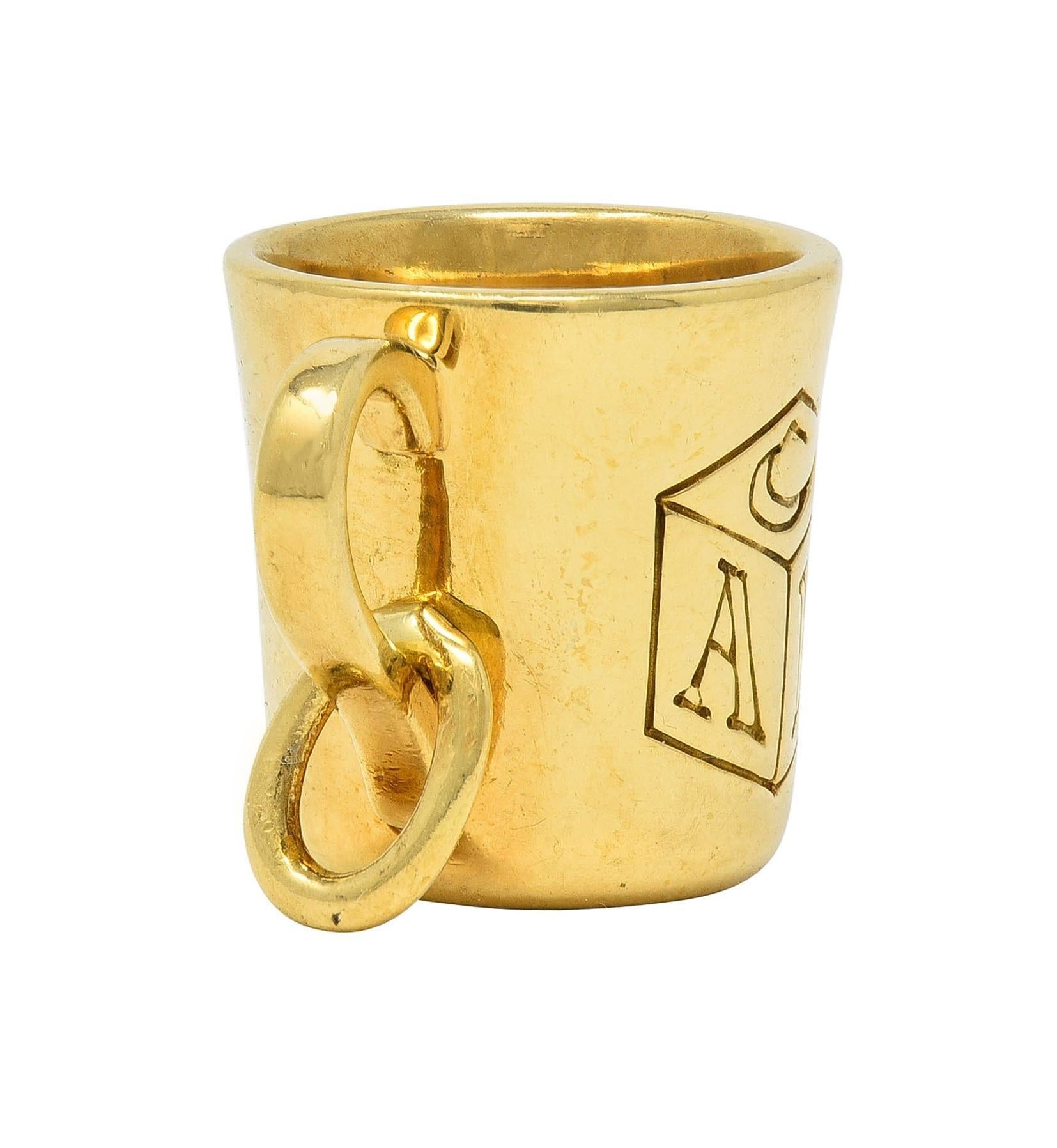 Designed as a baby cup with engraved detail
Depicting a wooden 'ABC' block
Suspending from jump ring bale
Stamped for 18 karat gold
Stamped for Tiffany & Co.
Circa: 1990s
Measures: 1/2 x 7/8 inch
Total Weight: 7.1 grams
Stock Number: We-13748