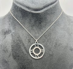 Tiffany & Co 1990's 18k white gold and diamond Atlas pendant