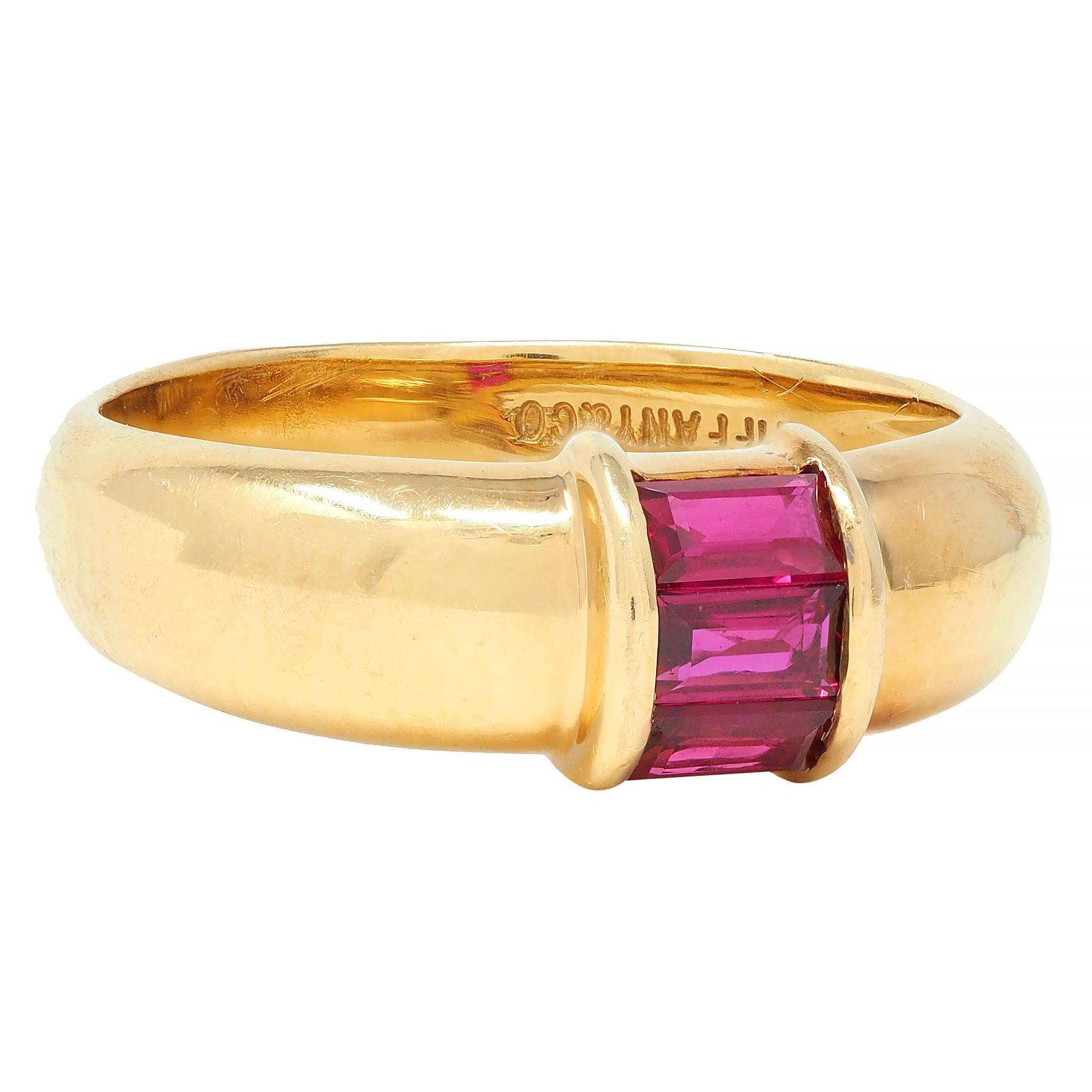 Designed as a slightly domed gold band ring channel set with rubies 
Weighing approximately 0.50 carat total - transparent medium red
Set north to south in arching station 
Complete by high polish finish
Stamped for 18 karat gold
Fully signed for