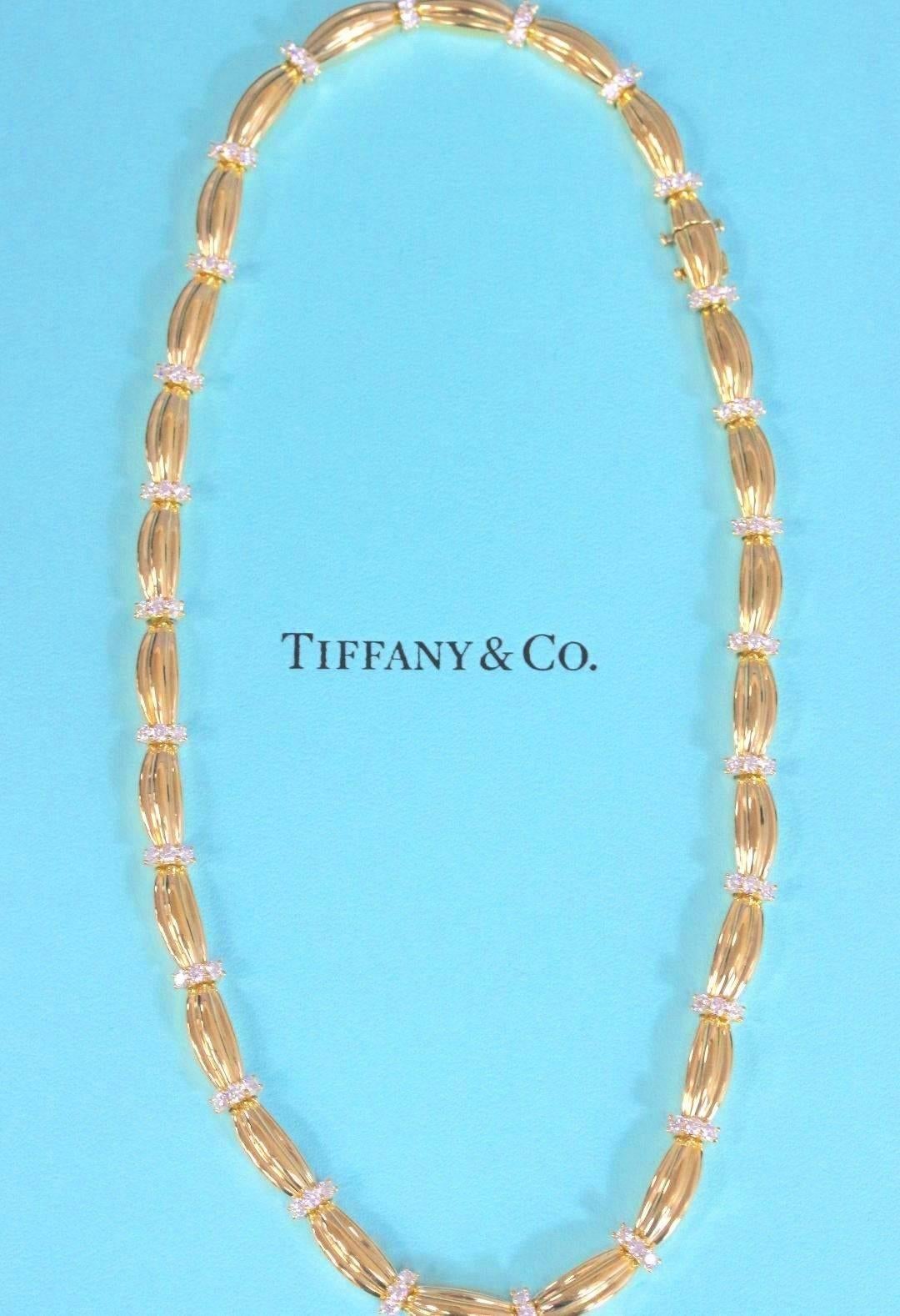 Tiffany & Co 
1992 Diamonds and 18KT Yellow Gold Station Necklace.  
The necklace consists of 78 Round Brilliant Cut Diamonds weighing 4.00 TCW G color, VS clarity.  
The length is 17 Inches.  
Hallmarked 