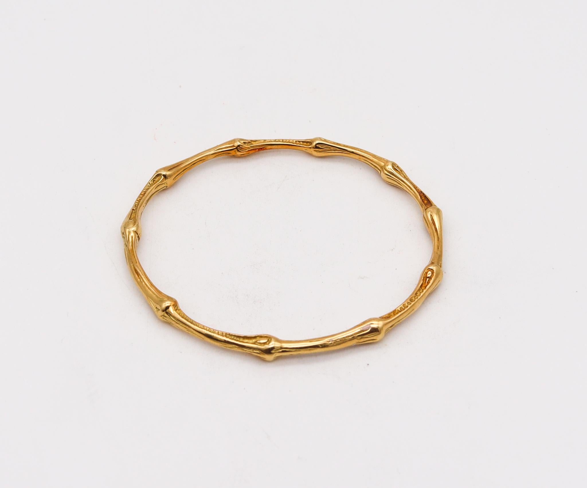 Bamboo slide bangle designed by Tiffany & Co.

Tiffany & Co 18K Gold Bamboo Bangle Bracelet. Circa 1996, crafted from solid 18K yellow gold featuring a bamboo pattern with 10 nodes with even internodal spacing. This model is very rare and extremely