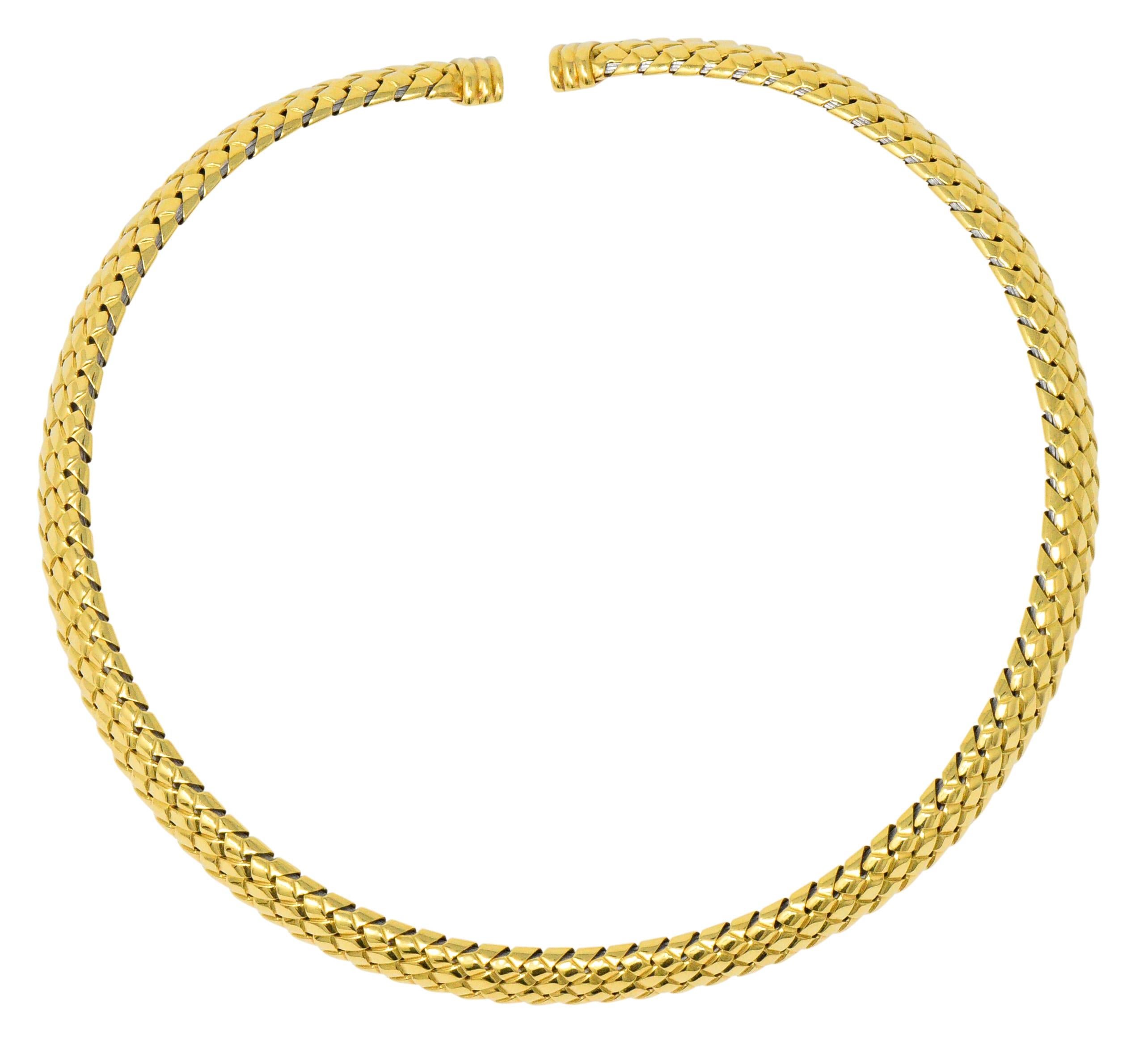 Woven highly polished gold with fluted gold terminals 

Inner flexible metal core

Fully singed Tiffany & Co. and dated 1997

Inner Circumference: 13 1/2 Inches 

Width: 10.0 mm

Total Weight: 85.8 Grams

Chic. Stylish. Refined. 

We- 1733