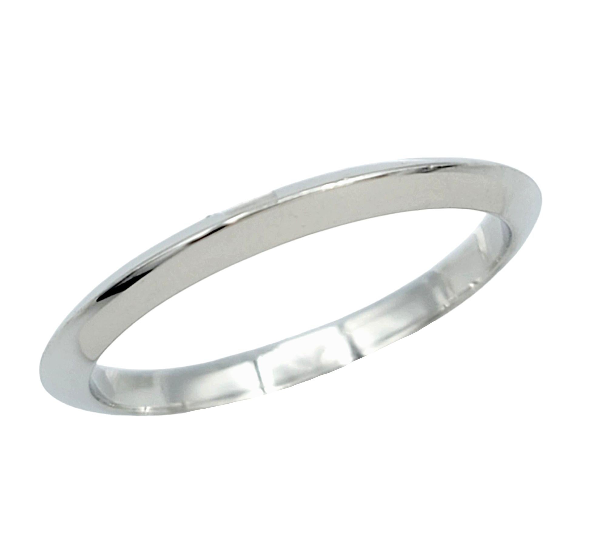 Ring Size: 6

Elegance meets simplicity in this timeless Tiffany & Co. band ring crafted from luxurious platinum. The 2 mm width of the ring provides a delicate presence on the finger, while the high-polish finish accentuates the inherent luster of