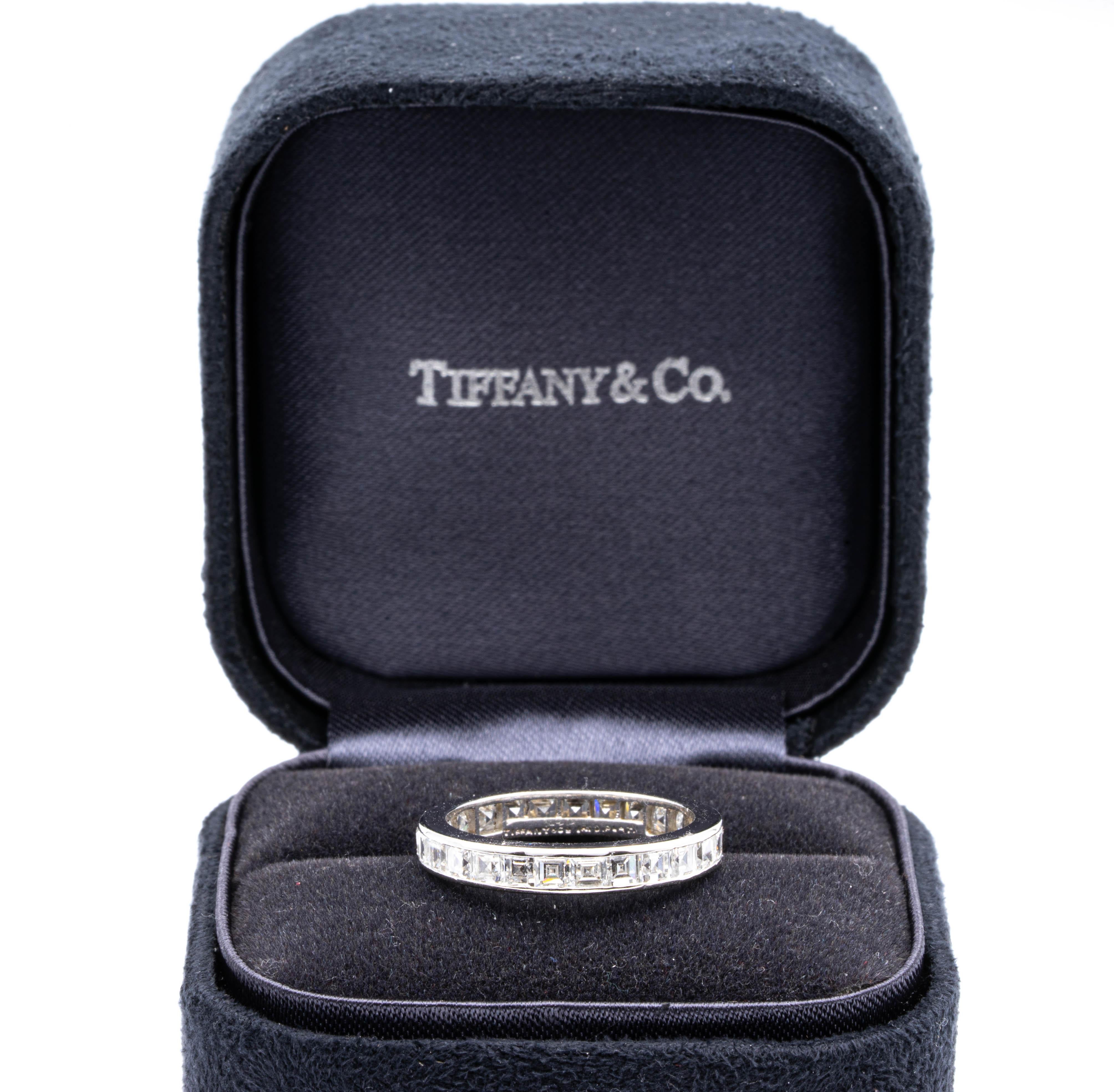 Tiffany & Co. Vintage Channel Diamond wedding band with 26 beautifully matched invisible set Carre (Asscher) cut diamonds weighing 2.00 carats total weight approximately. The diamonds are very white F color and VS clarity.  Originally Purchased from