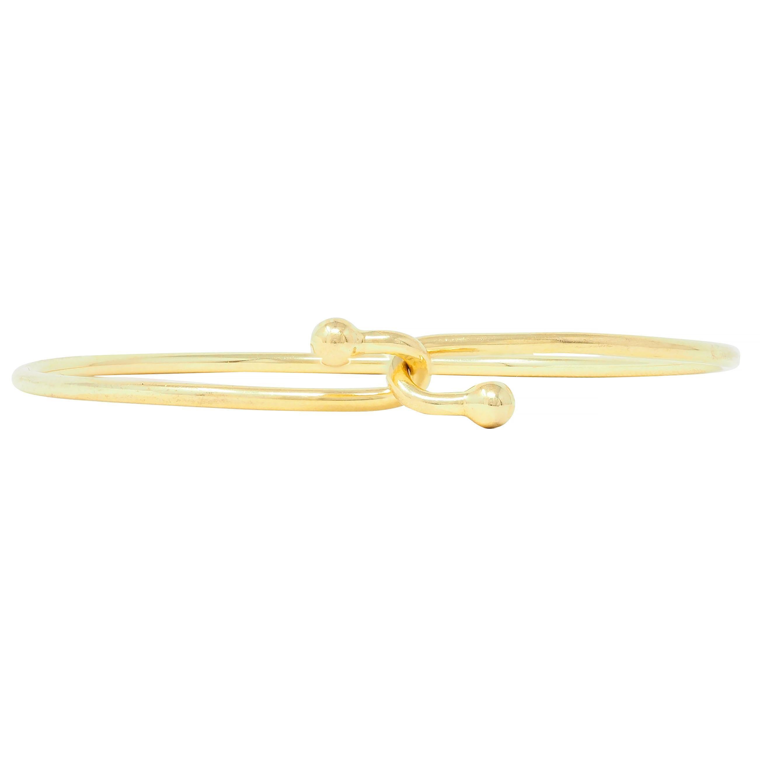 Women's or Men's Tiffany & Co. 2000's 18 Karat Yellow Gold Interlocking Hook Bangle Bracelet