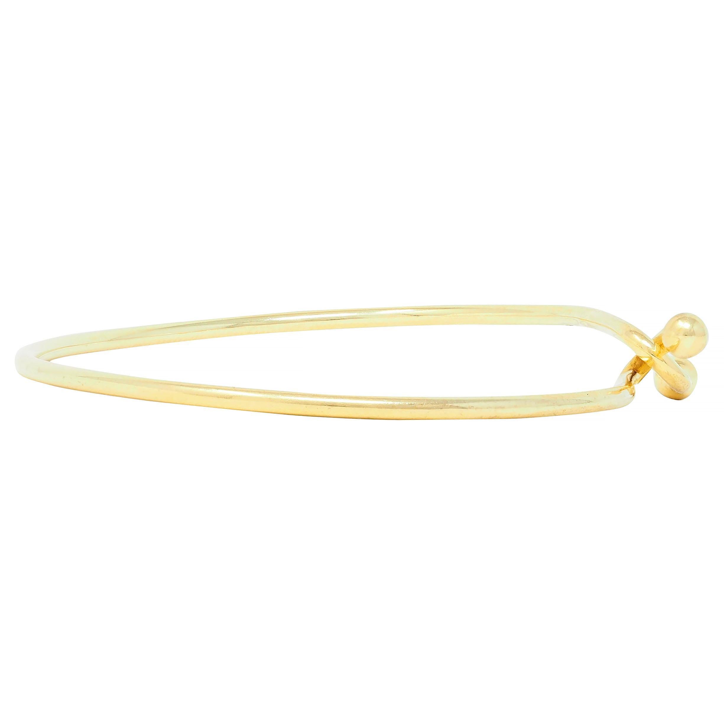 Tiffany & Co. 2000's 18 Karat Yellow Gold Interlocking Hook Bangle Bracelet For Sale 1