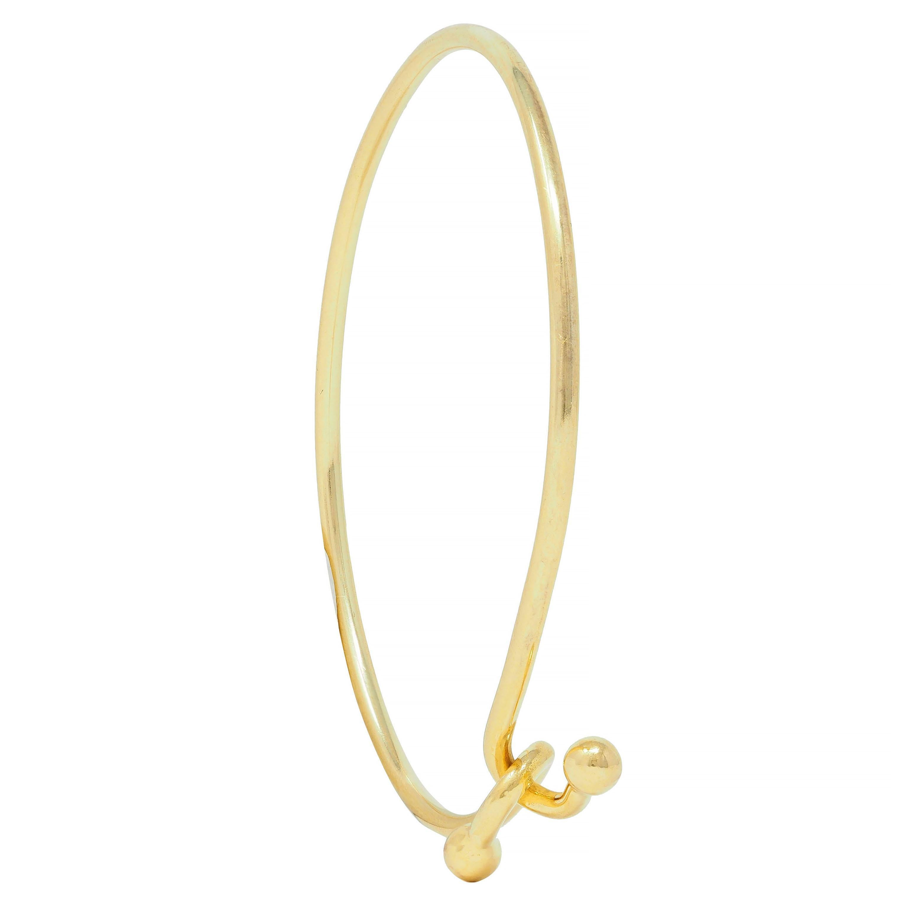 Tiffany & Co. 2000's 18 Karat Yellow Gold Interlocking Hook Bangle Bracelet For Sale 4