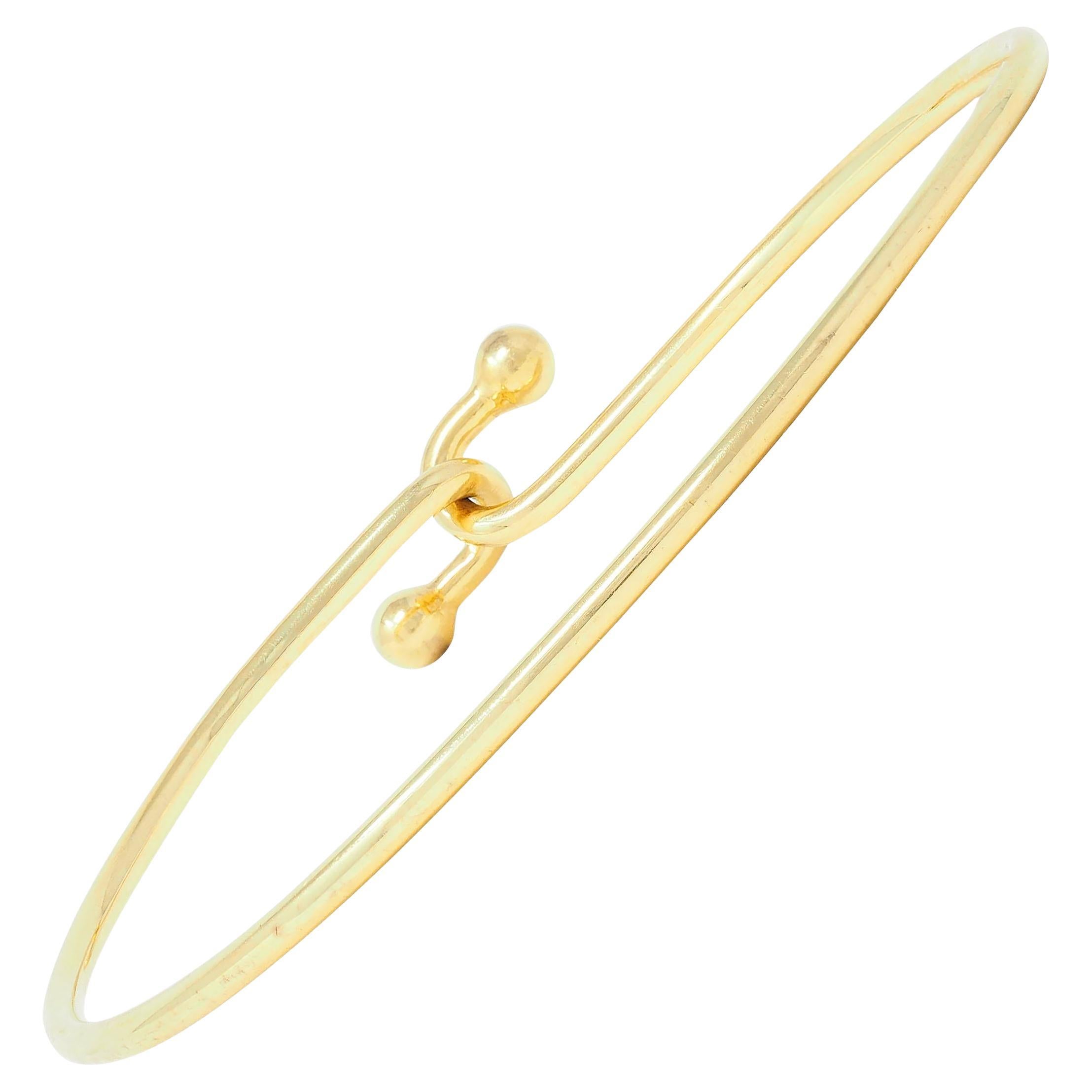 Tiffany & Co. 2000's 18 Karat Yellow Gold Interlocking Hook Bangle Bracelet For Sale