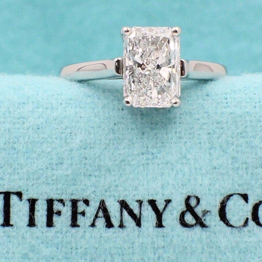 Tiffany & Co.

Style:  Solitaire
Serial Number:  D40475
Metal:  Platinum PT950
Size:  5.75 - sizable  
Total Carat Weight:  2.07 CTS
Diamond Shape:  Radiant Cut
Diamond Color & Clarity:  E / VS1
Hallmark:   D40475 PT950  TIFFANY&CO. 